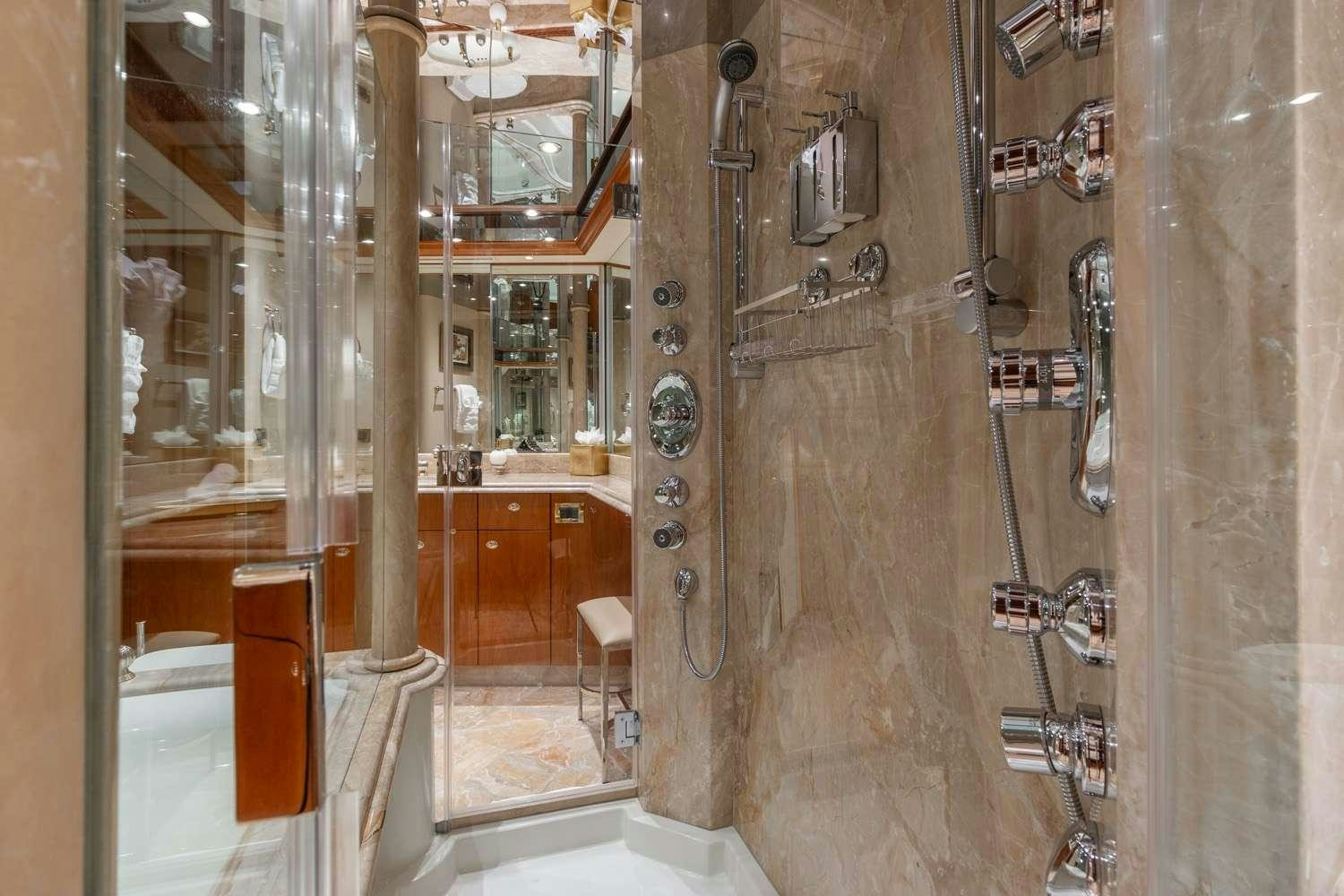 a bathroom with a glass shower aboard MY WAY Yacht for Charter
