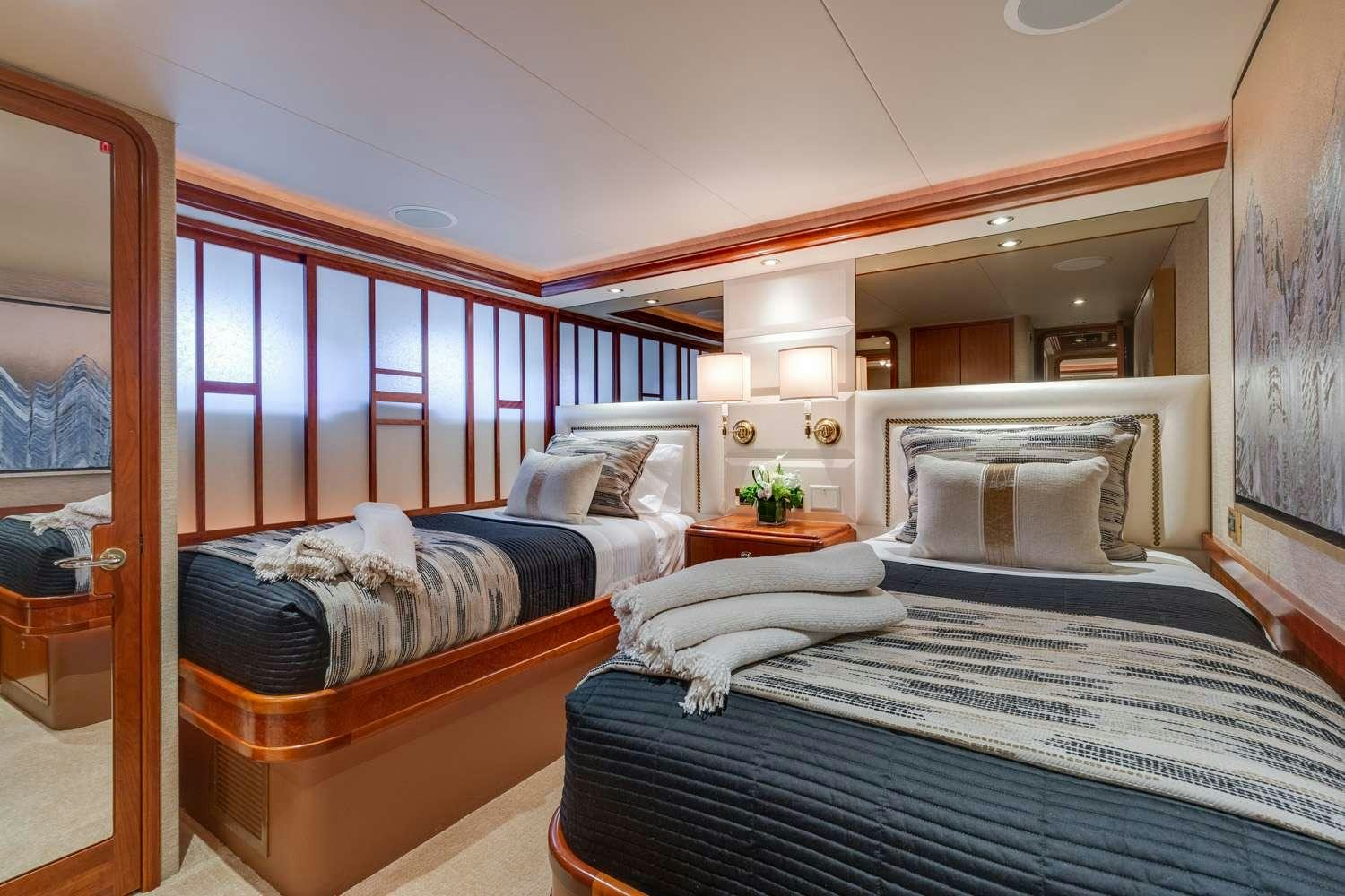 a room with two beds aboard MY WAY Yacht for Charter