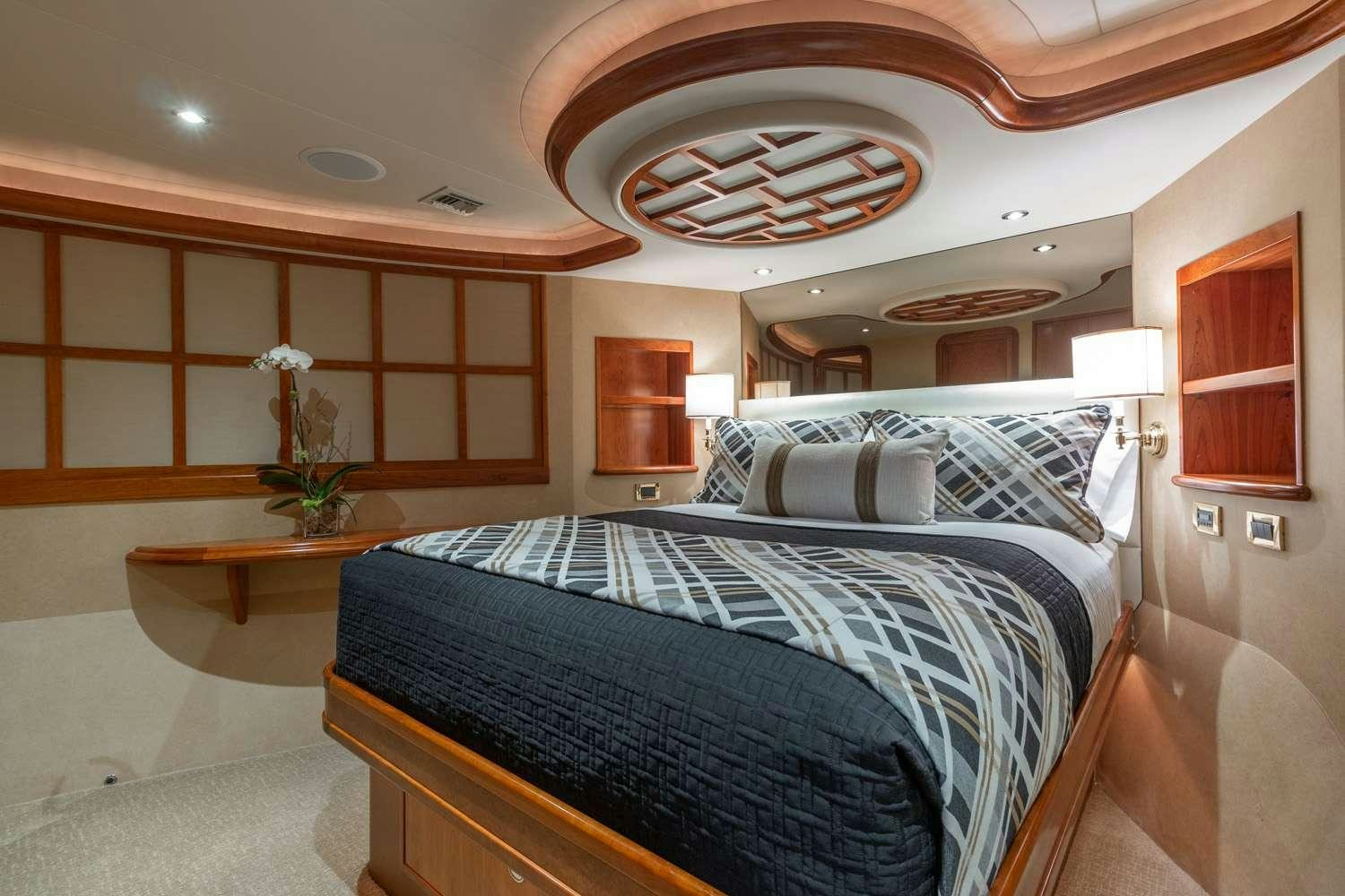 a bedroom with a large bed aboard MY WAY Yacht for Charter