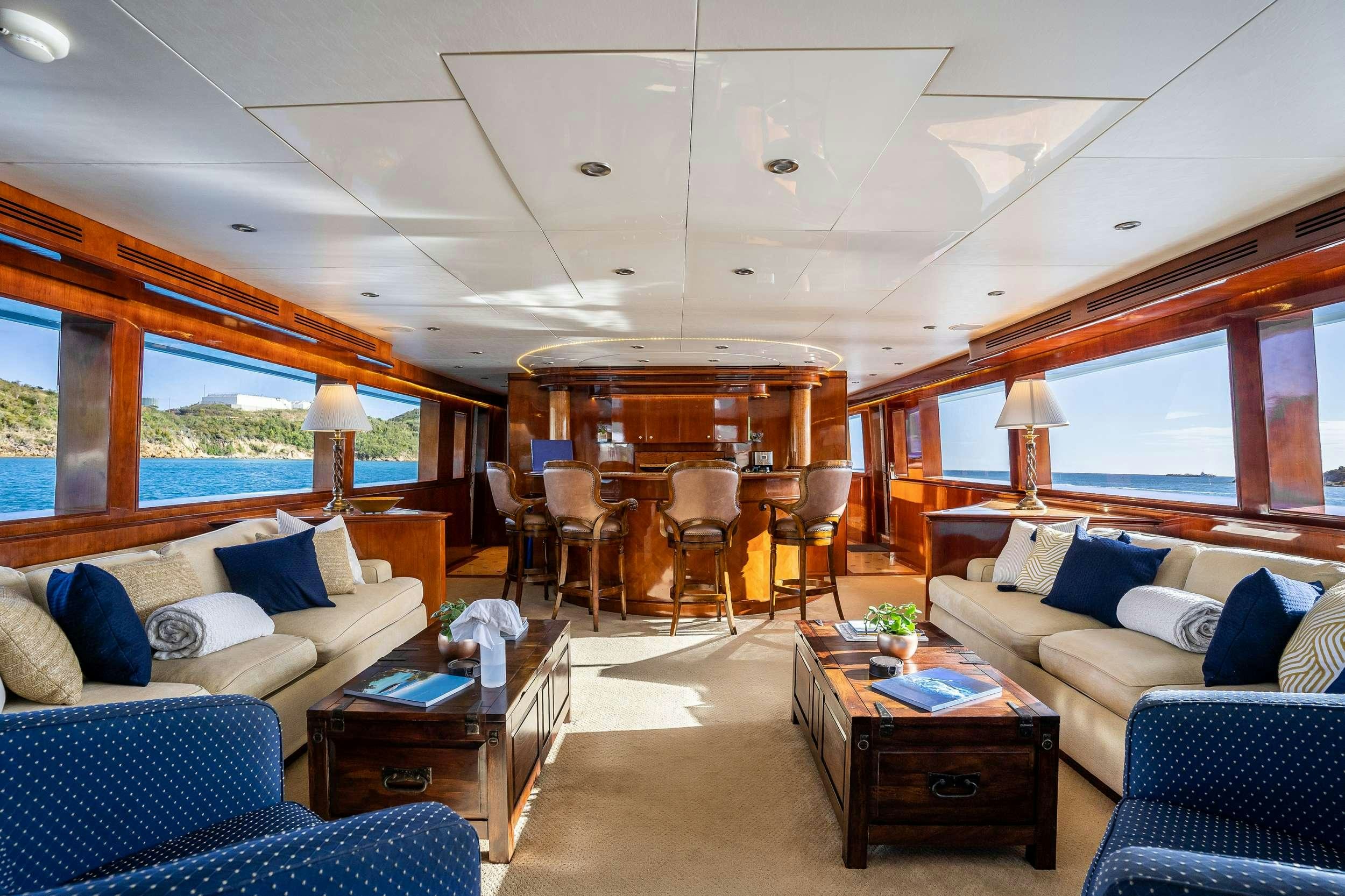 a living room with a large window aboard OUTTA TOUCH Yacht for Charter