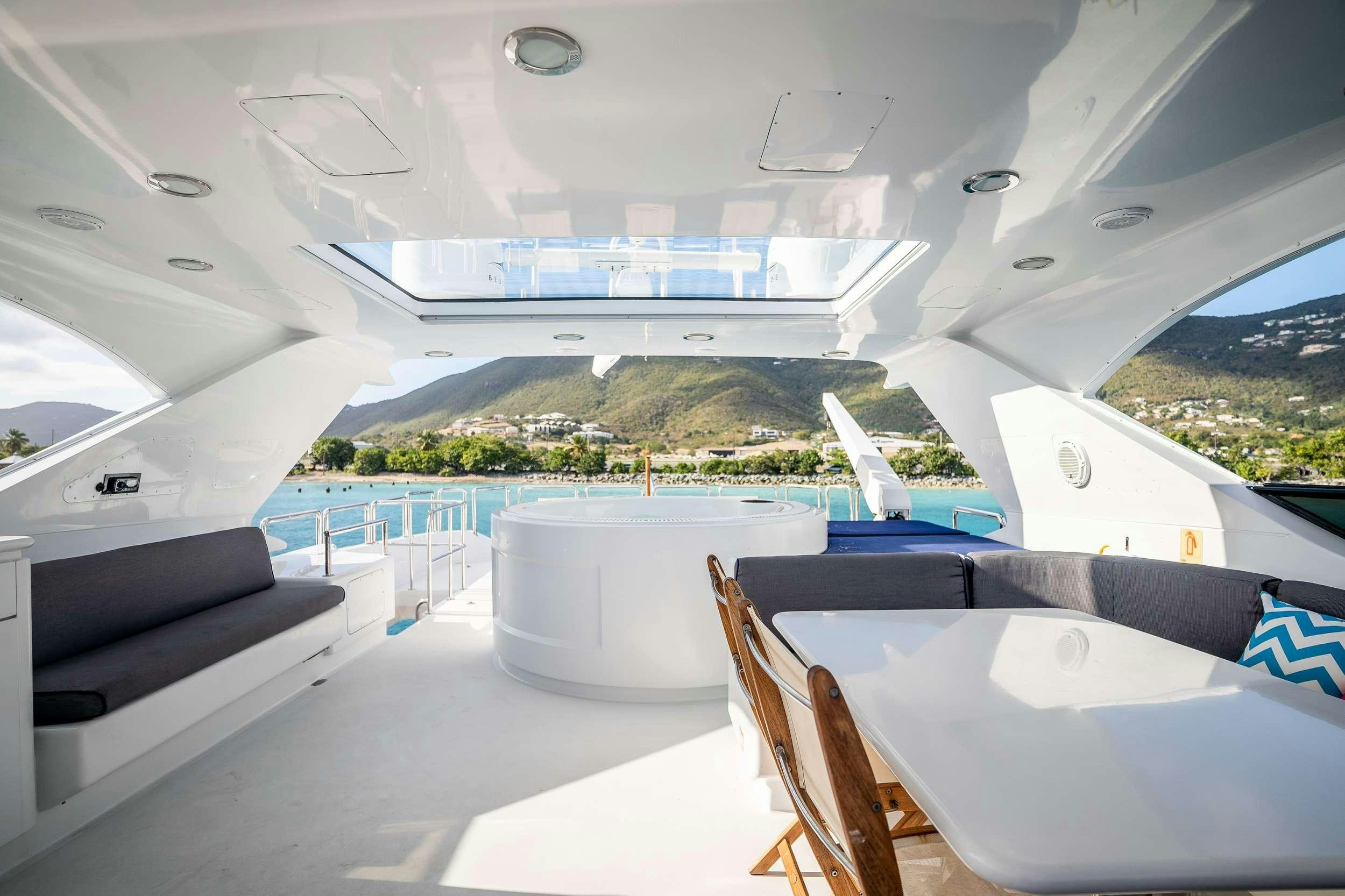 a room with a view of a mountain and water aboard OUTTA TOUCH Yacht for Charter