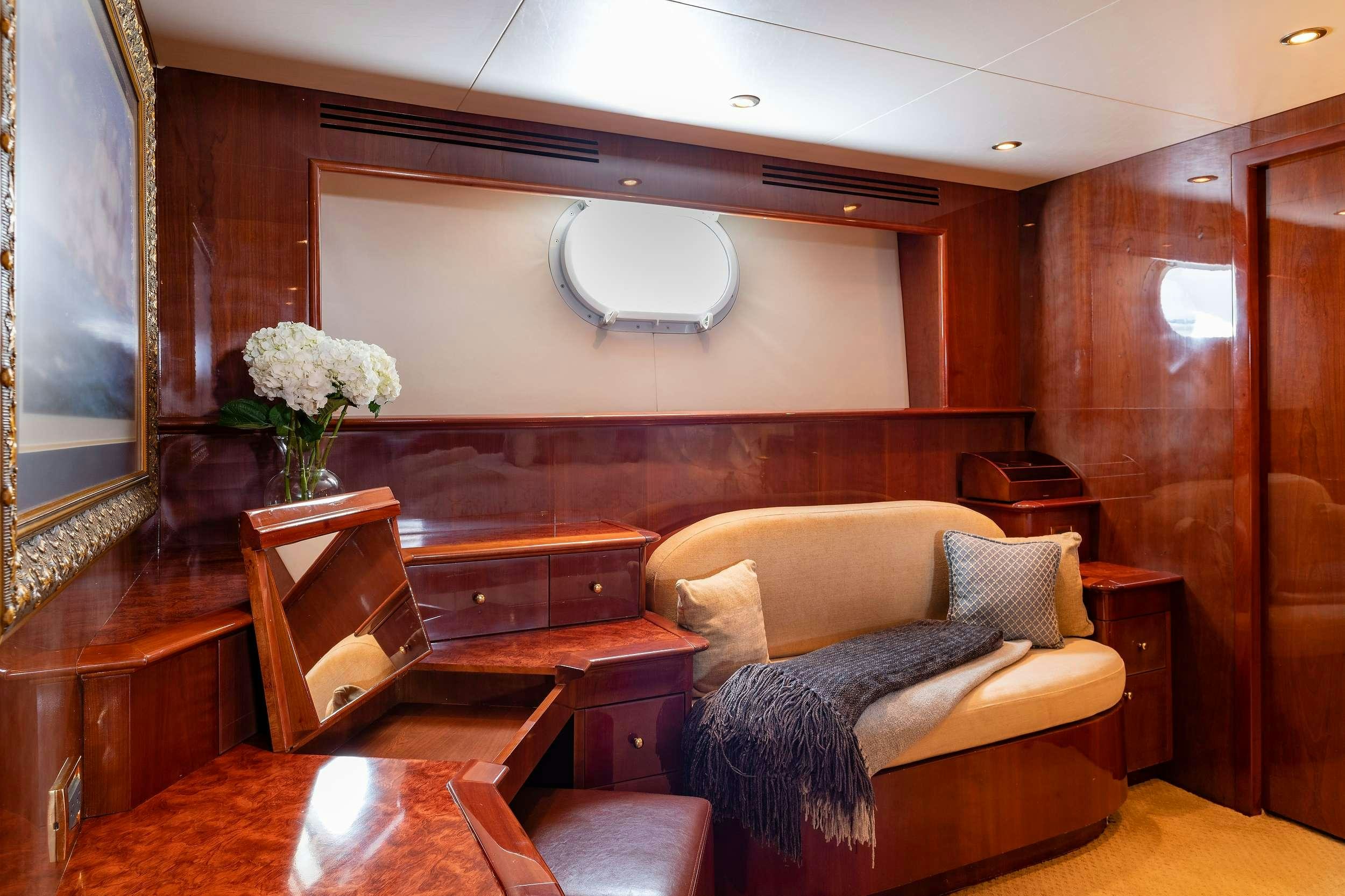 a living room with a wood wall aboard OUTTA TOUCH Yacht for Charter