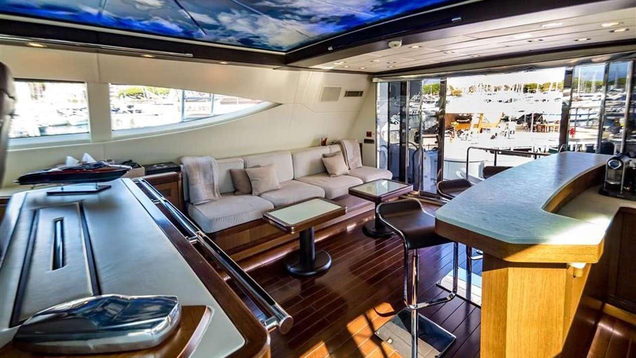 a room with a table and couches aboard DAYA Yacht for Charter