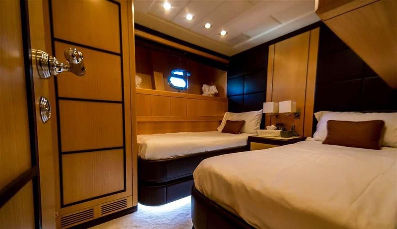 a room with two beds aboard DAYA Yacht for Charter