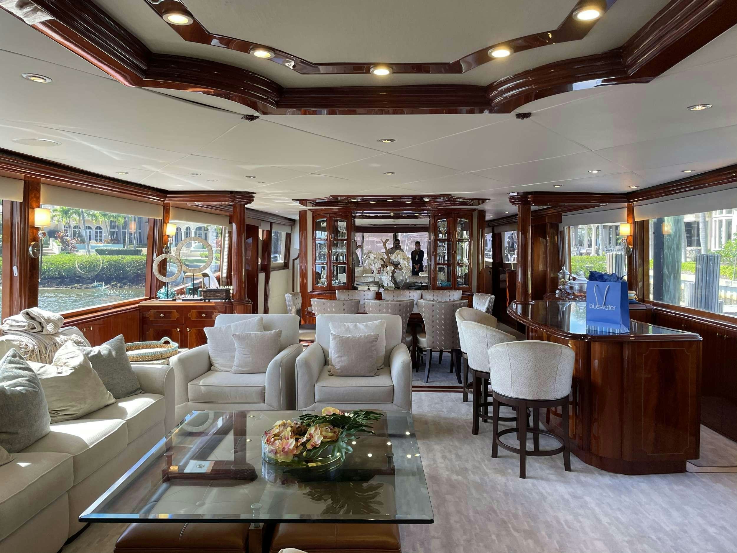 a living room with a large window aboard Passion Yacht for Charter