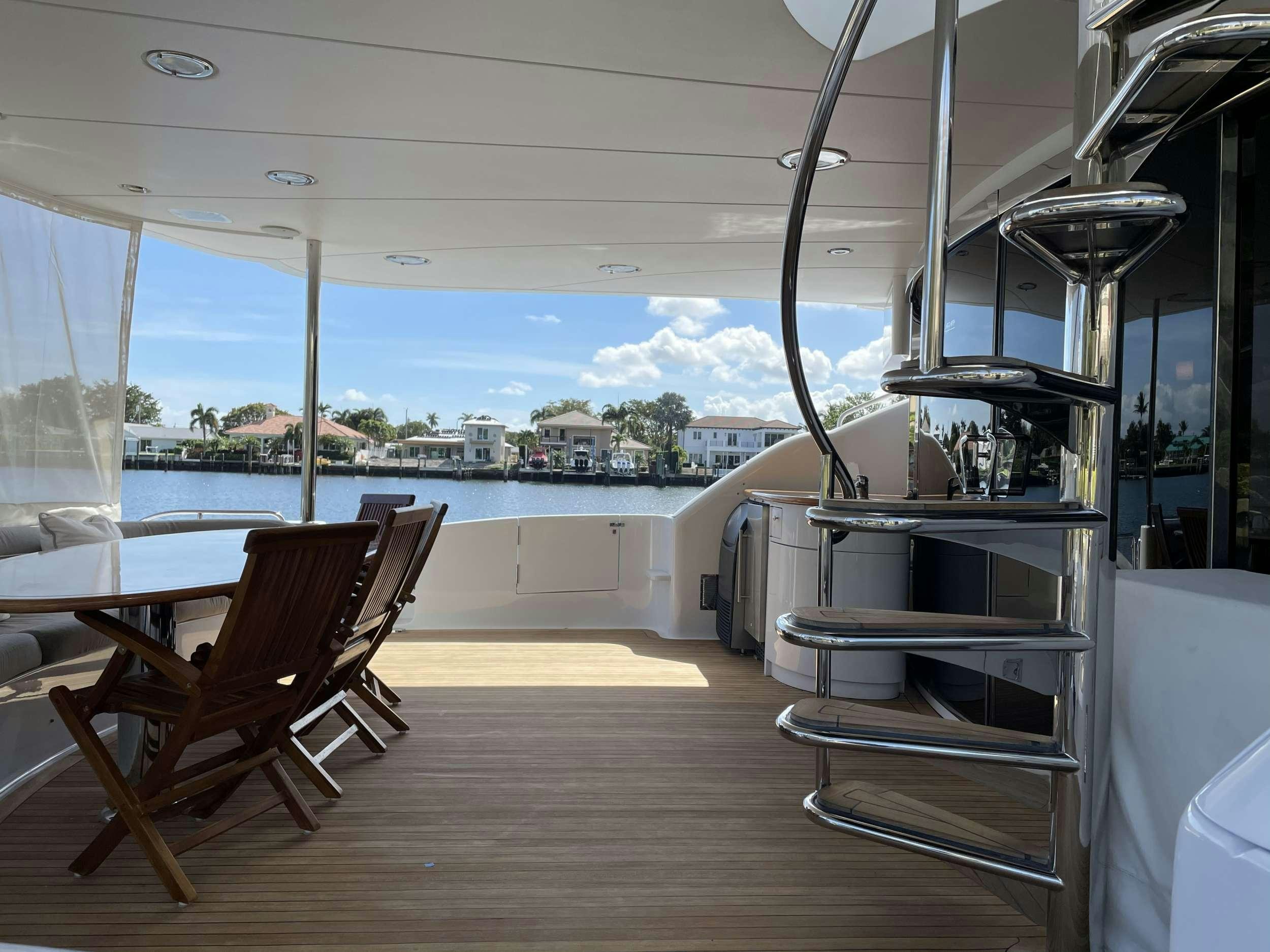 a room with a table and chairs aboard Passion Yacht for Charter