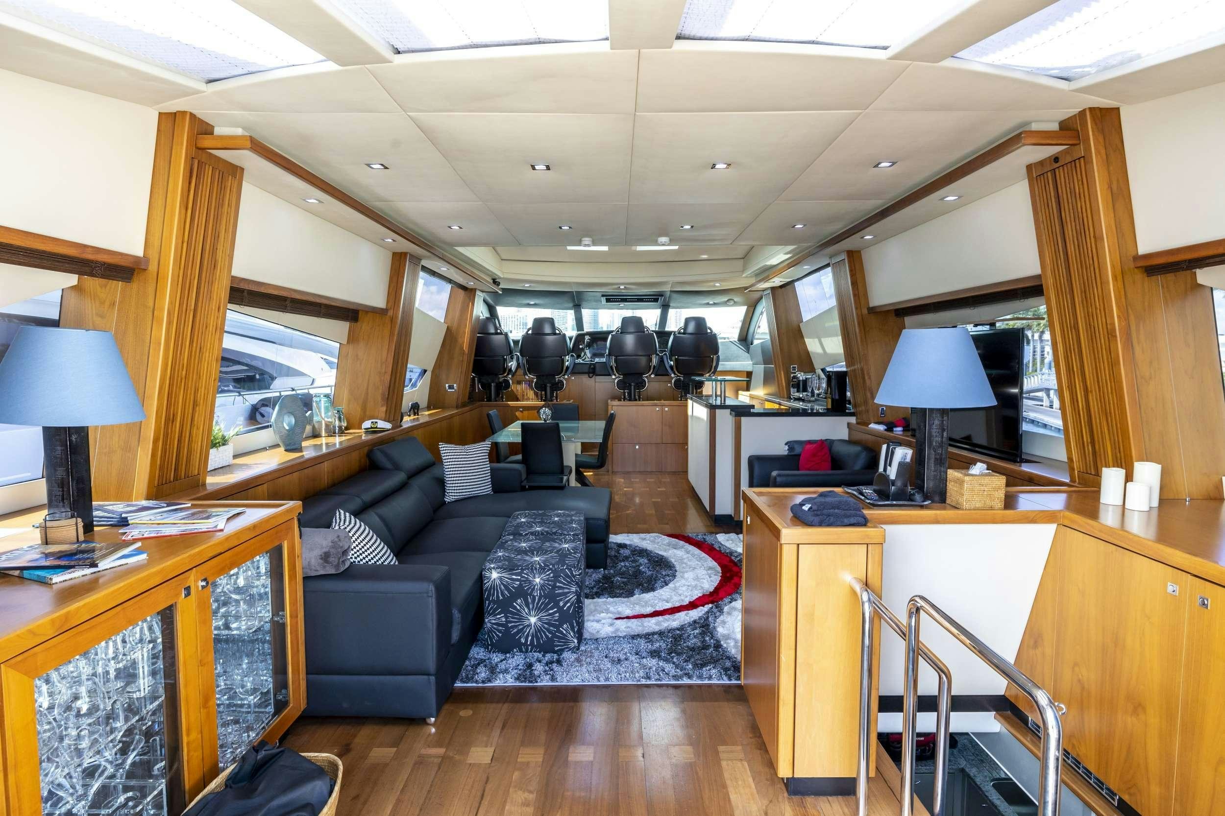 a living room with a couch and a table aboard sky fall Yacht for Charter