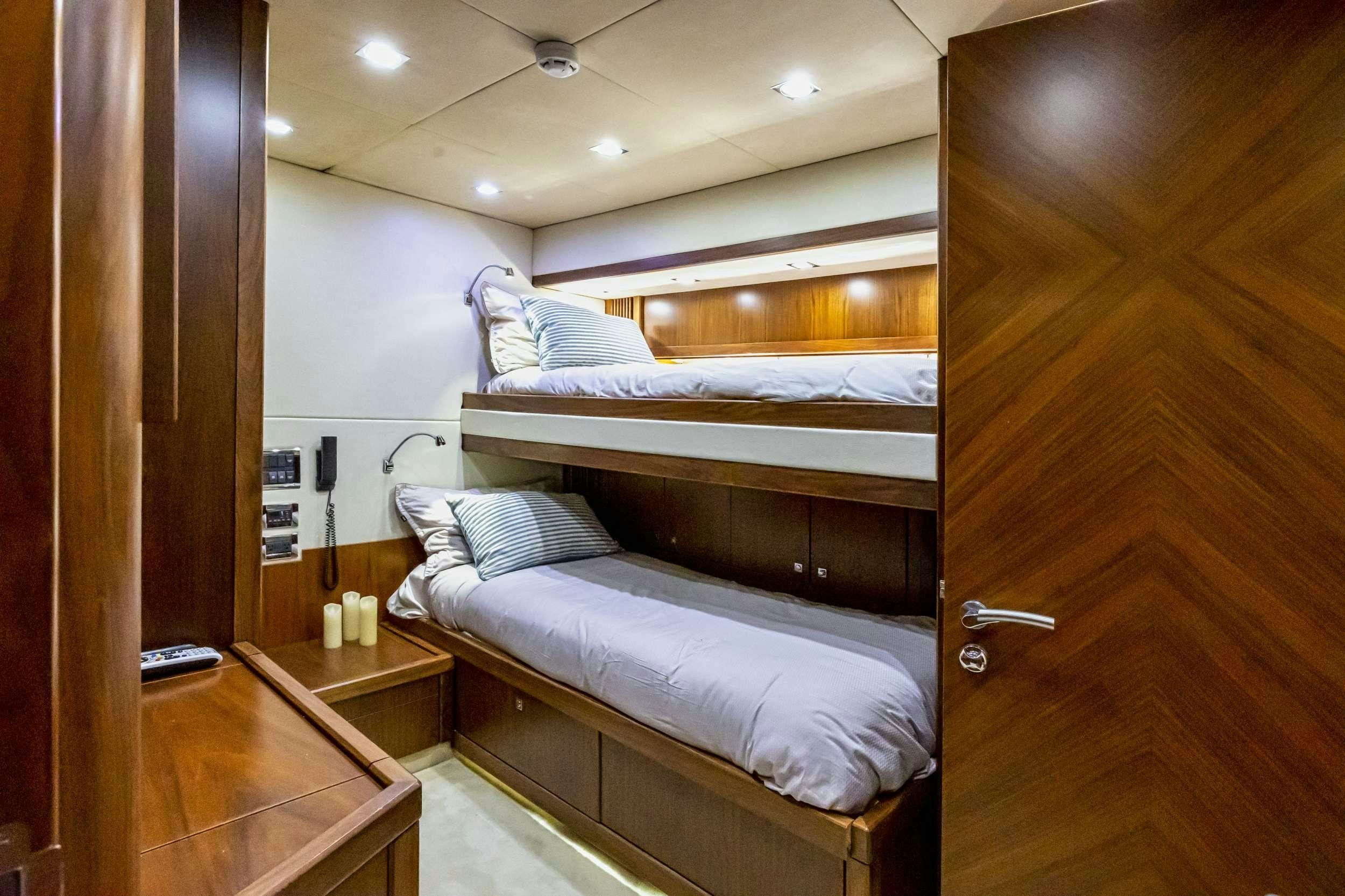 a room with a couple of beds aboard sky fall Yacht for Charter