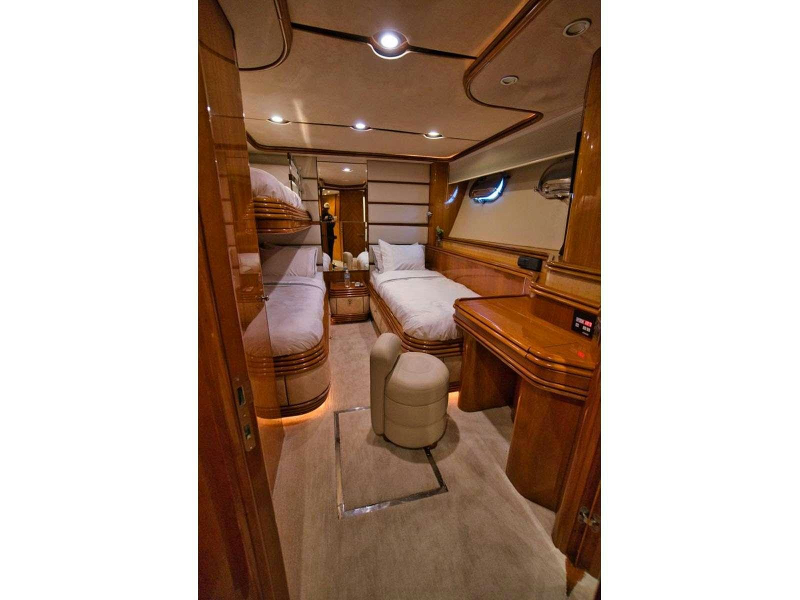 a room with a mirror and a bed aboard YCM 105 Yacht for Charter