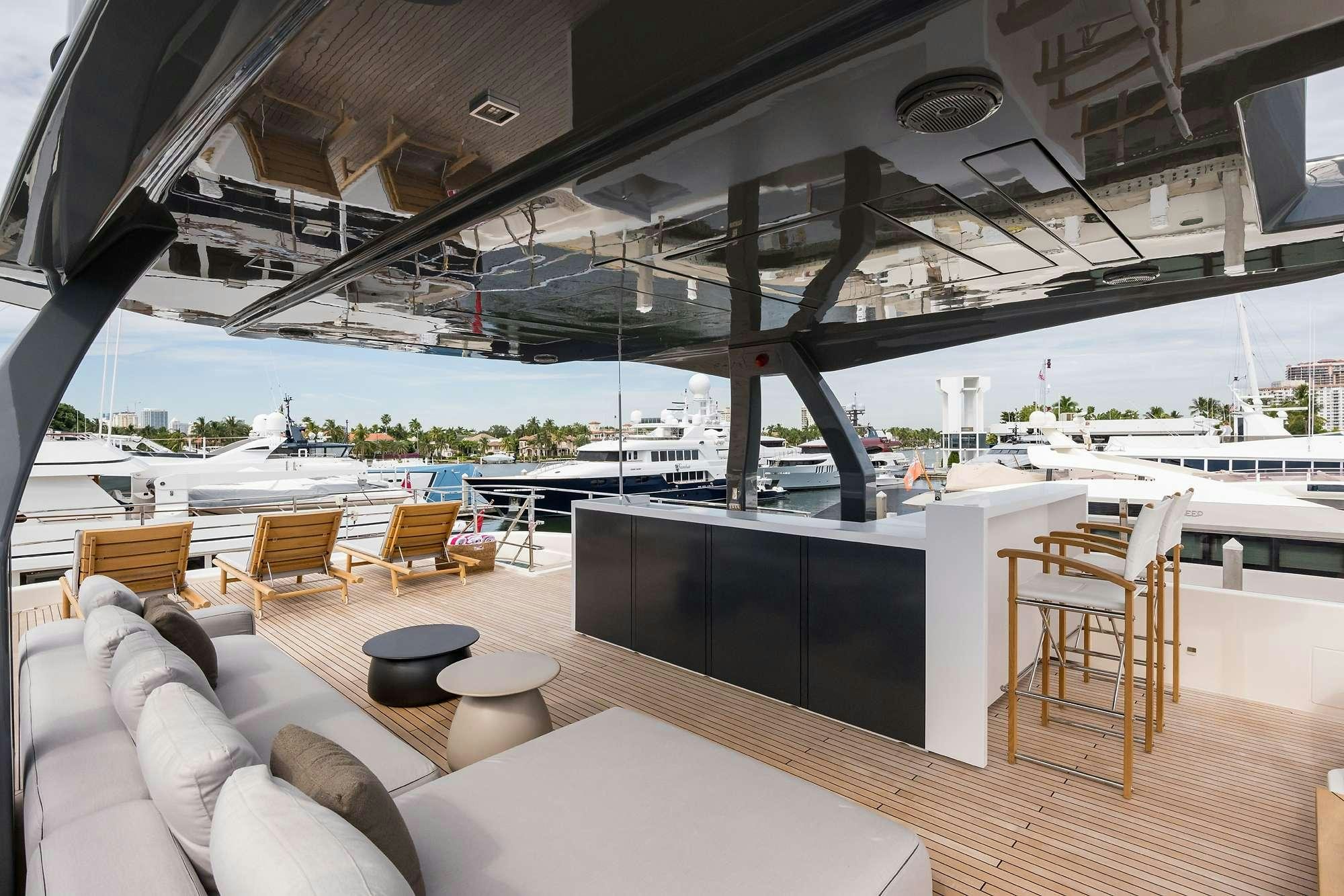 a room with a couch and a table and chairs aboard GIOIA Yacht for Charter