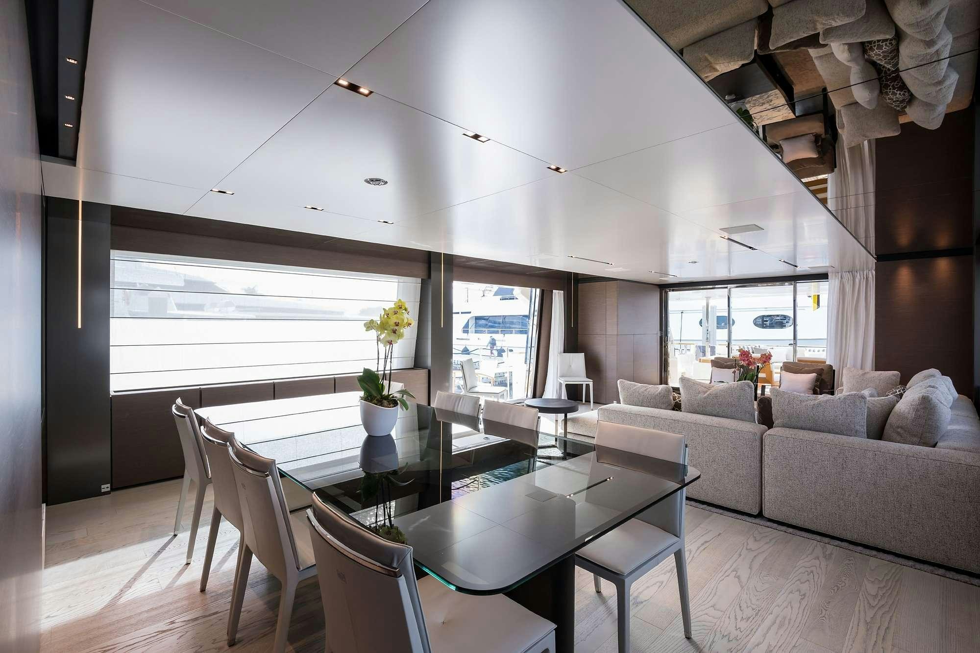 a living room with a couch and a table aboard GIOIA Yacht for Charter