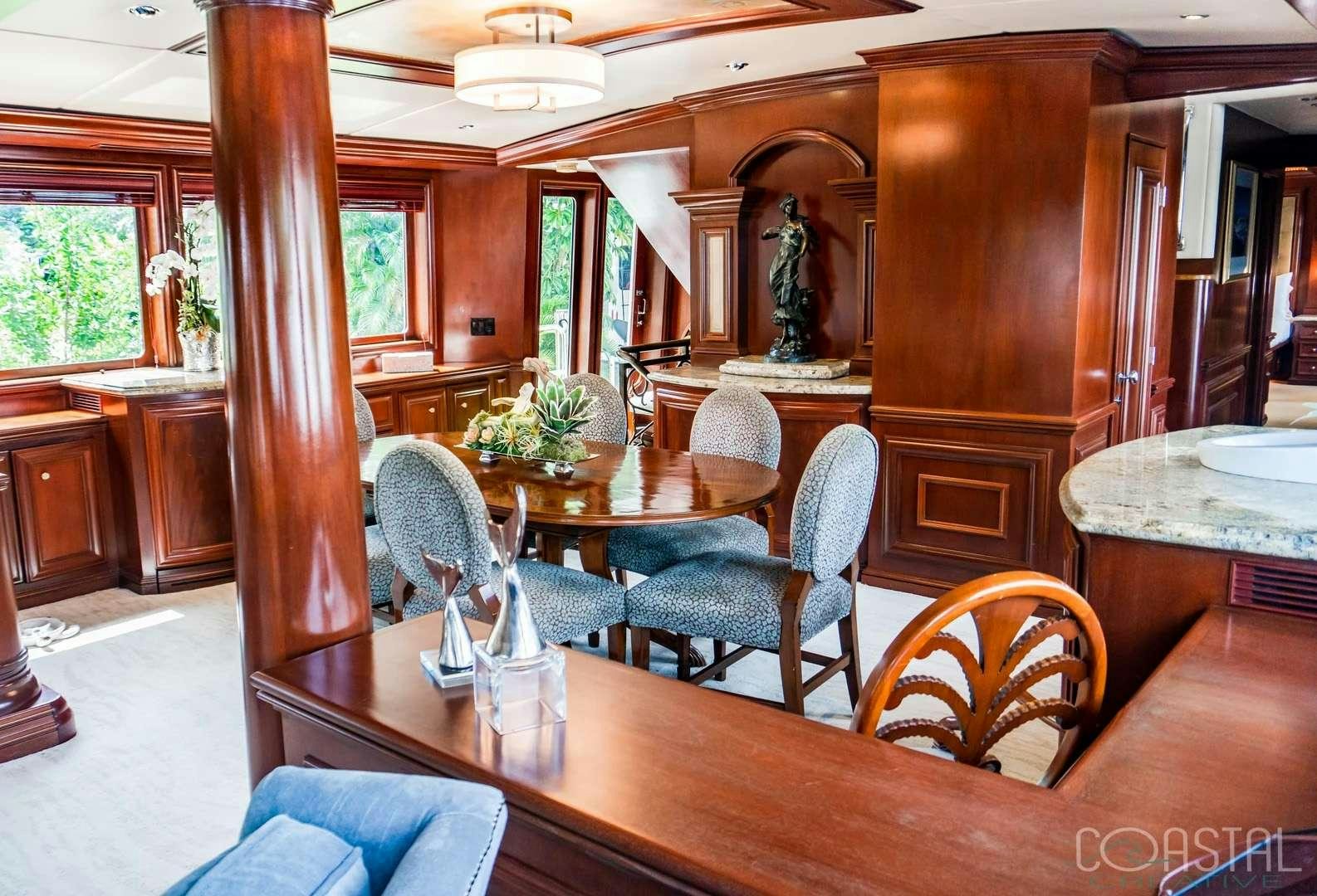 a dining room with a table aboard THREE KINGS Yacht for Charter