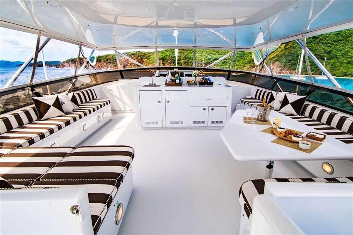 a large white tent with a table and chairs aboard THREE KINGS Yacht for Charter
