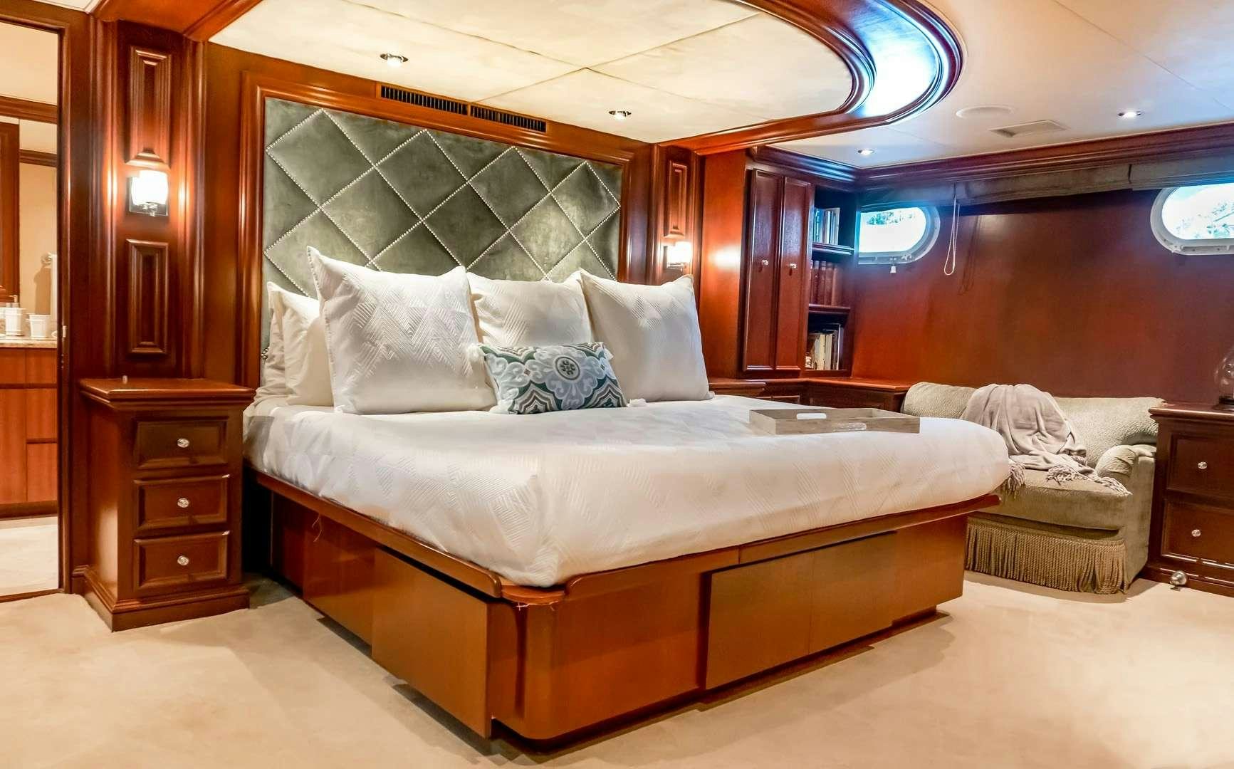 a bed in a room aboard THREE KINGS Yacht for Charter
