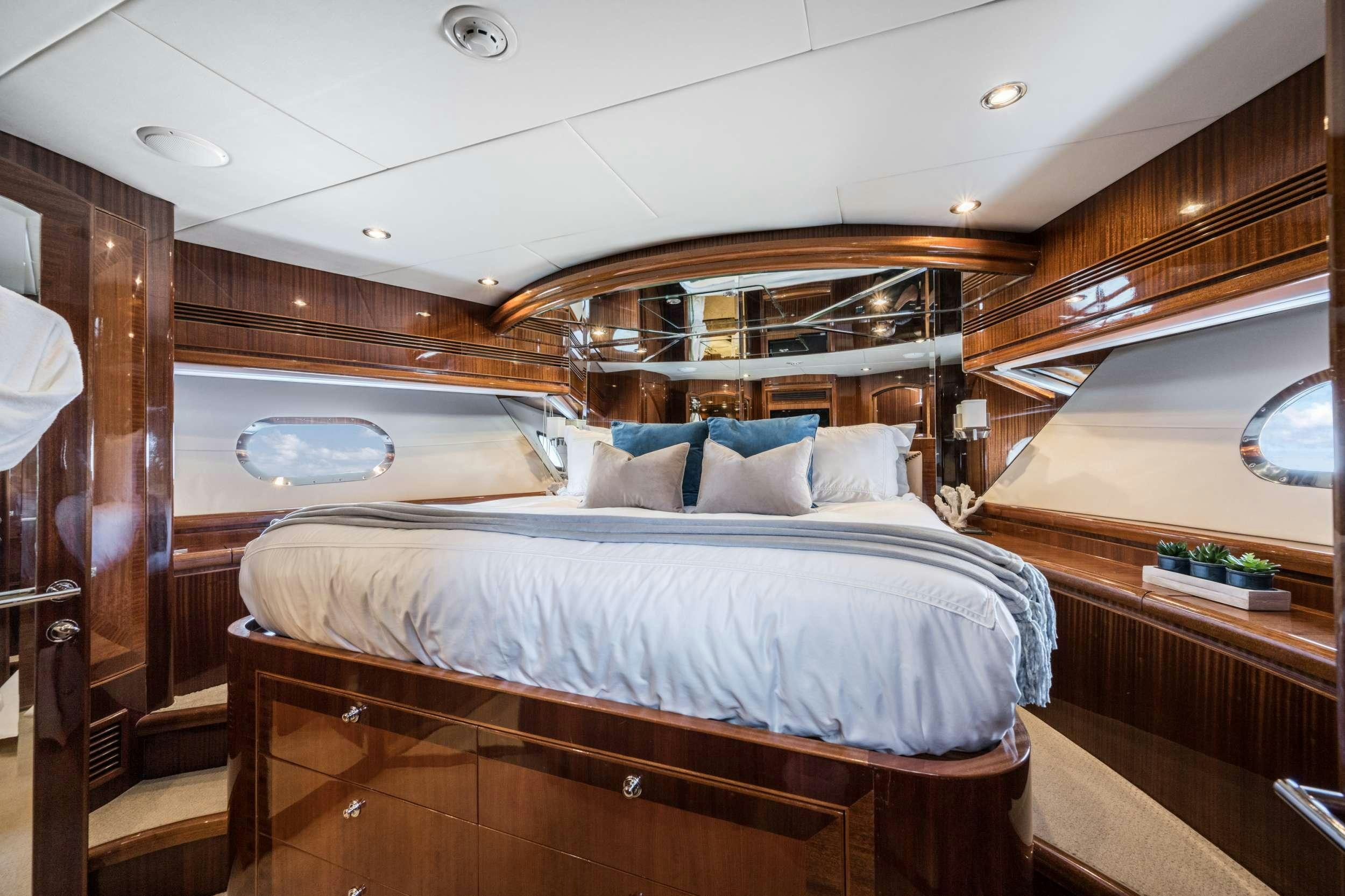 a bed in a room aboard LIMITLESS Yacht for Charter