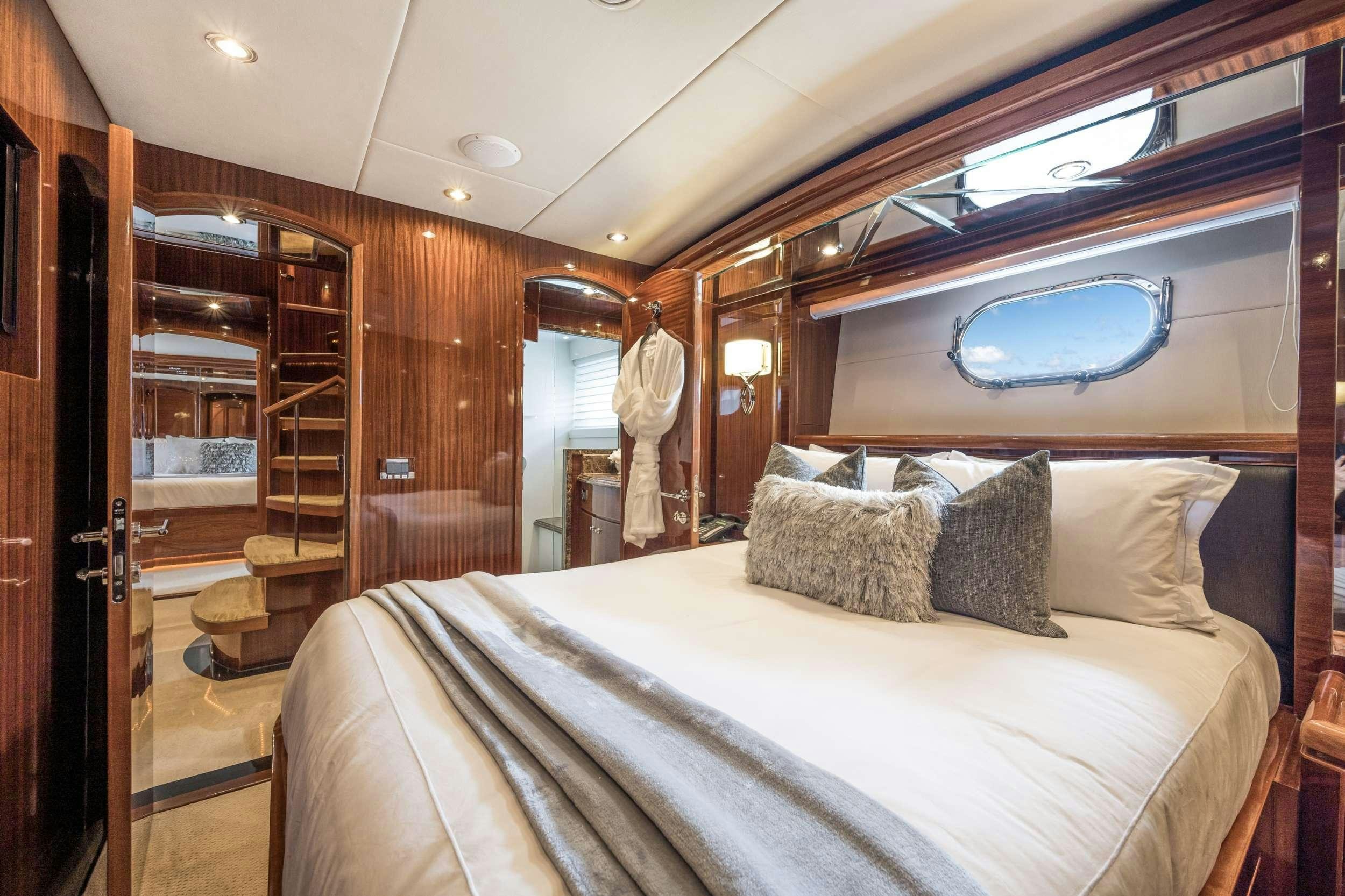 a bed in a cabin aboard LIMITLESS Yacht for Charter