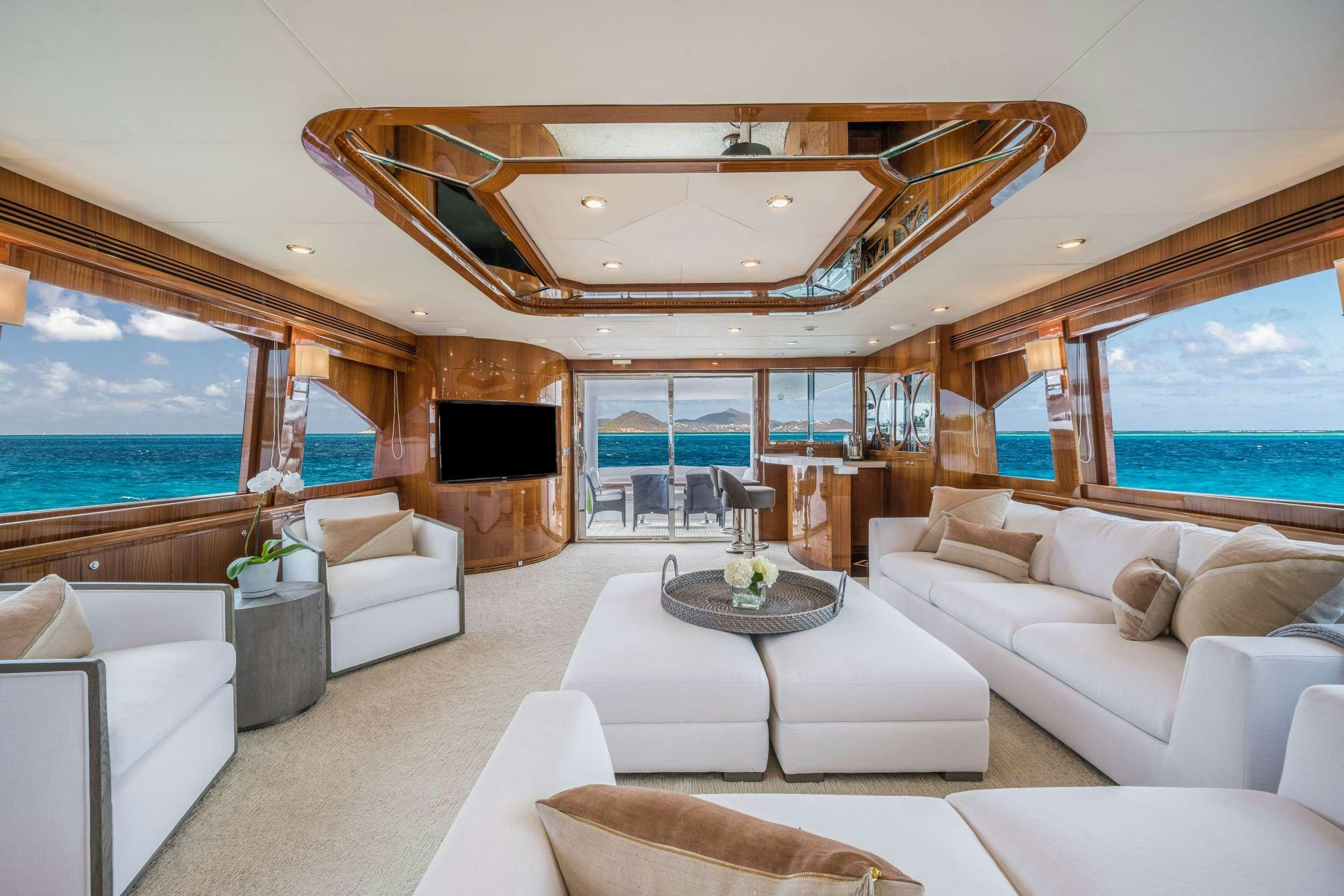 a living room with a fireplace aboard LIMITLESS Yacht for Charter