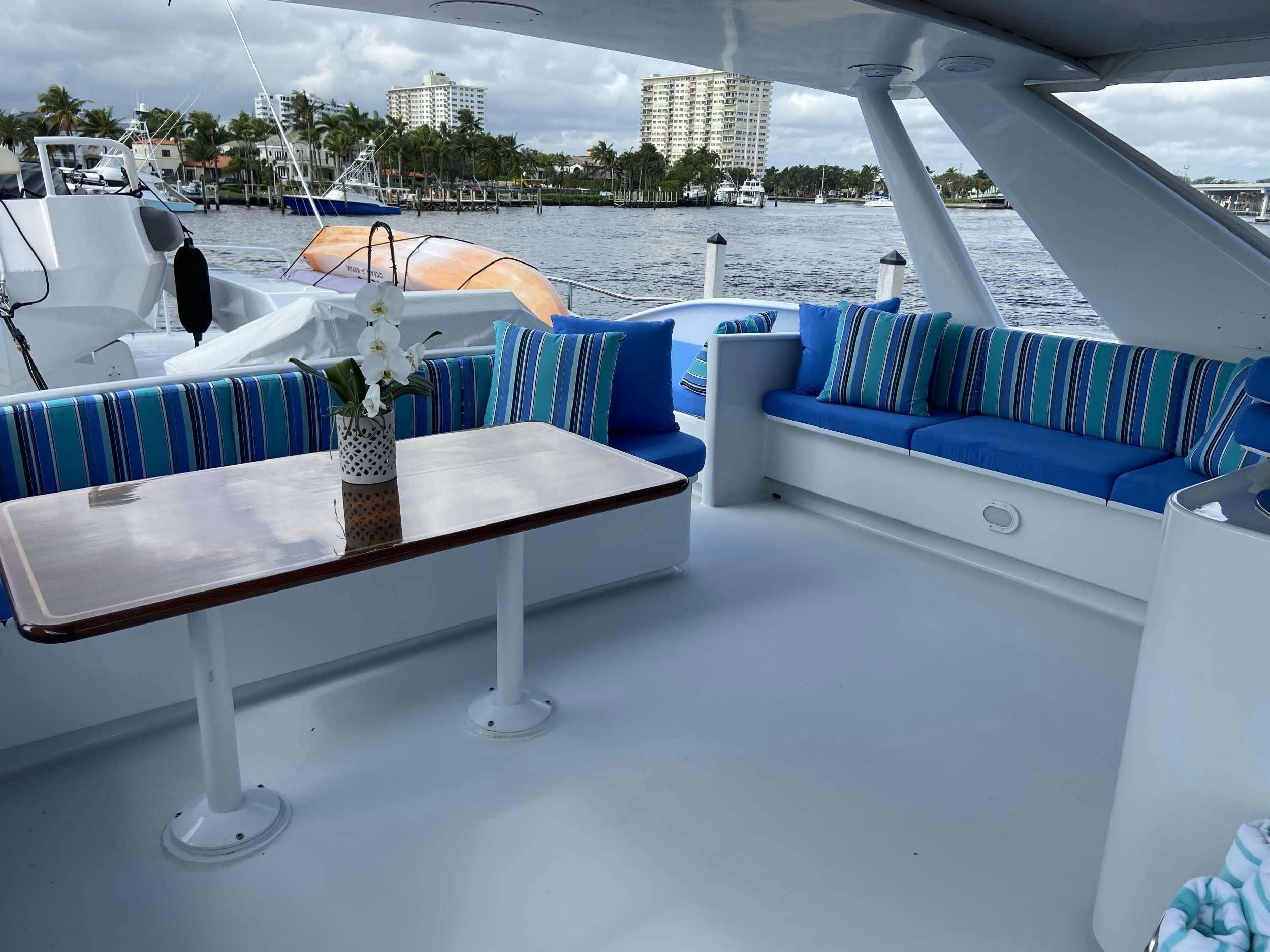 a table with flowers on it aboard LADY GRAY Yacht for Charter