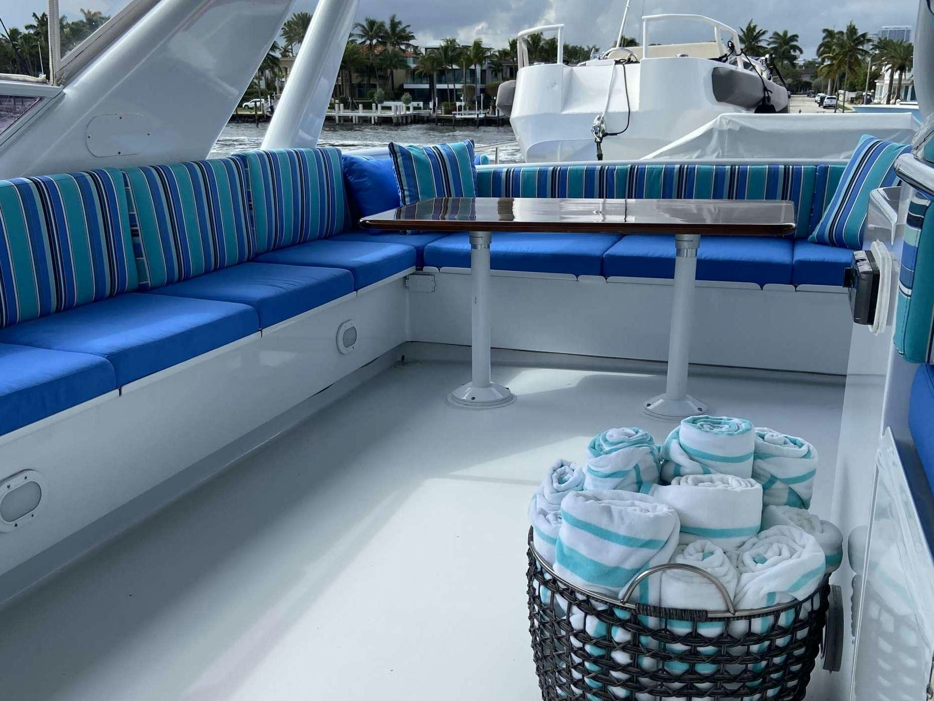 a boat with blue and white striped seats aboard LADY GRAY Yacht for Charter