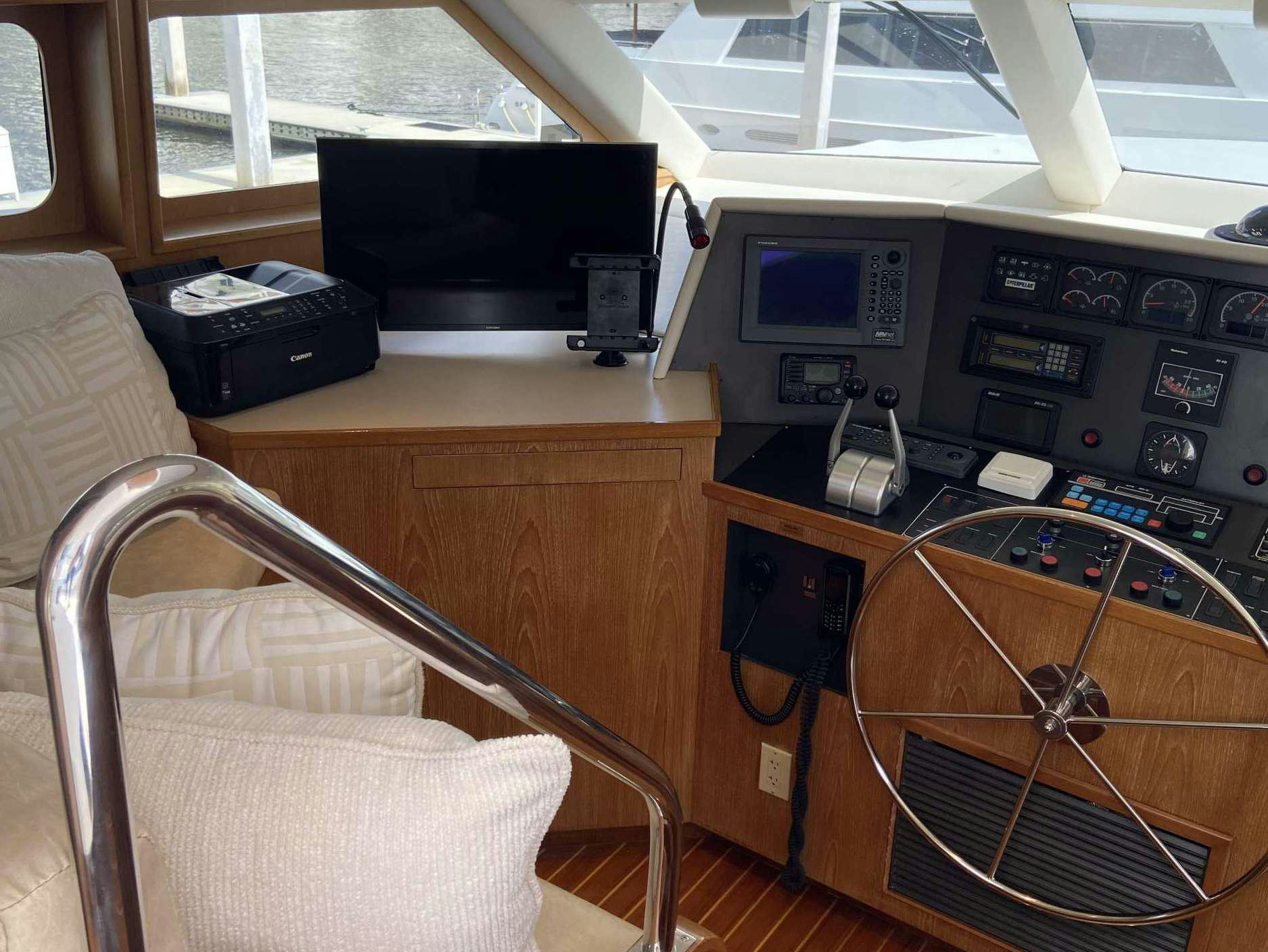 a desk with a computer and a chair aboard LADY GRAY Yacht for Charter