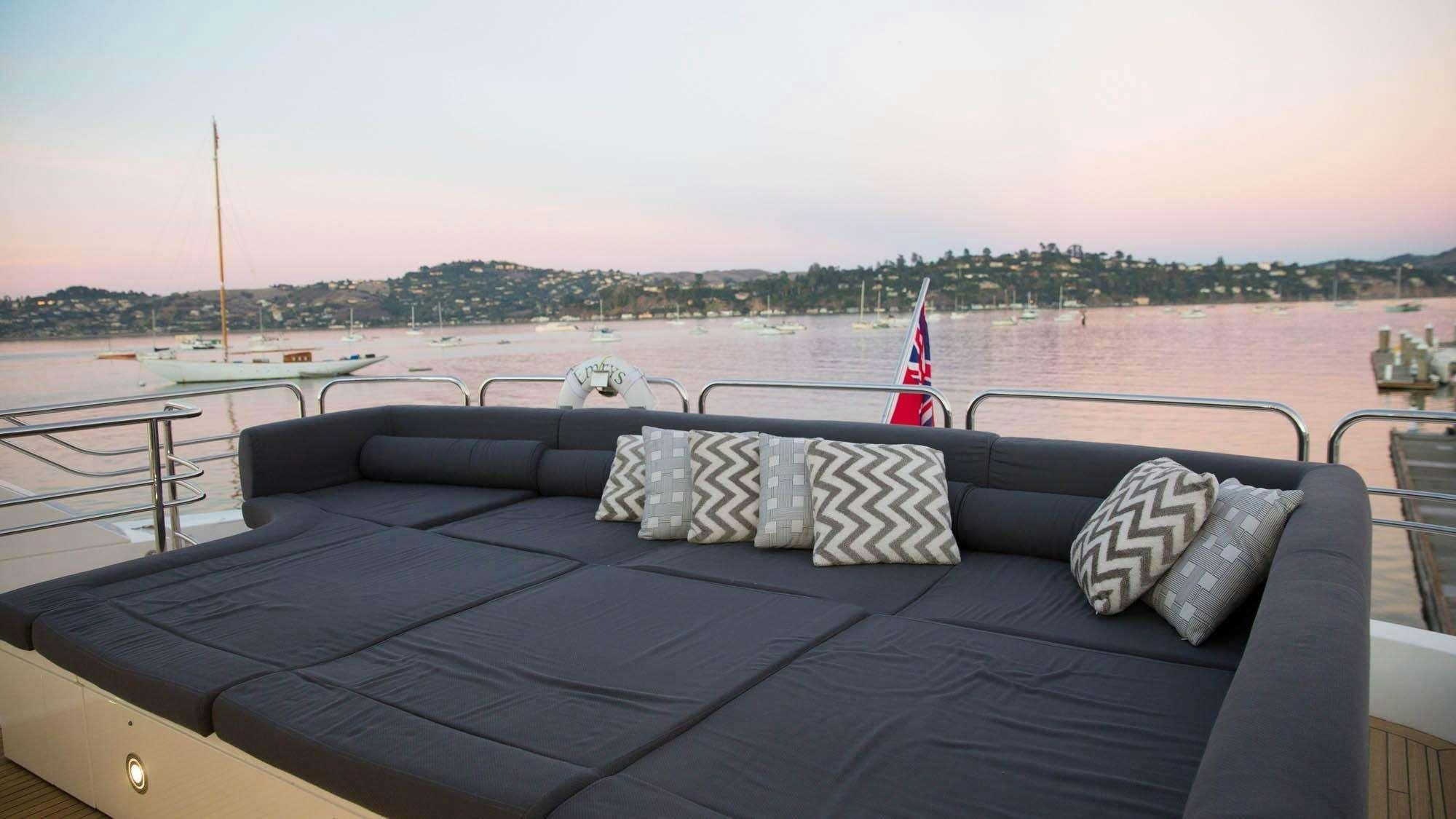 a boat with pillows on a deck aboard EMRYS Yacht for Charter