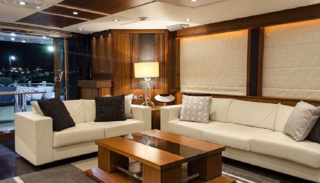 a living room with a couch and a table aboard EMRYS Yacht for Charter