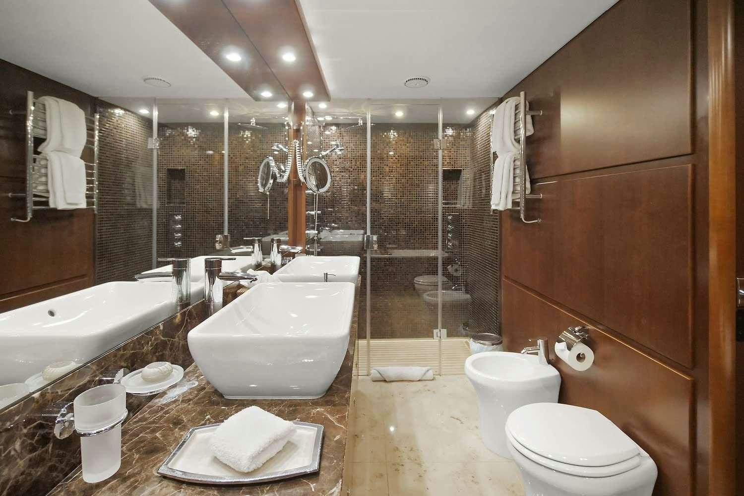 a bathroom with a large marble counter aboard 21 SEA SANDS Yacht for Charter