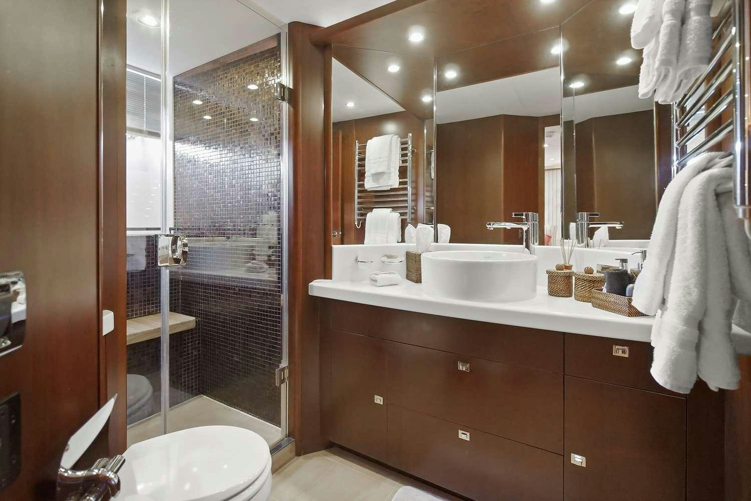 a bathroom with a large mirror aboard 21 SEA SANDS Yacht for Charter
