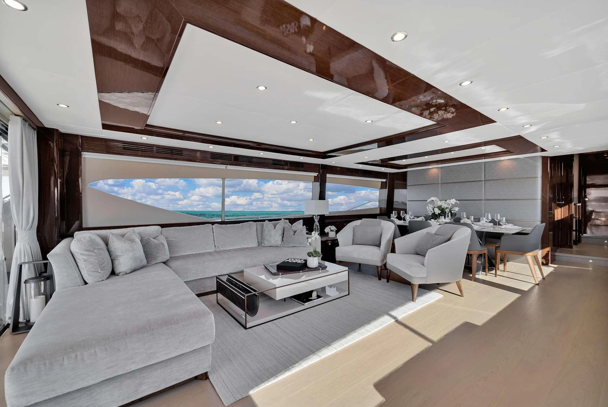 a room with a couch and a tv aboard CURRENT $EA Yacht for Charter