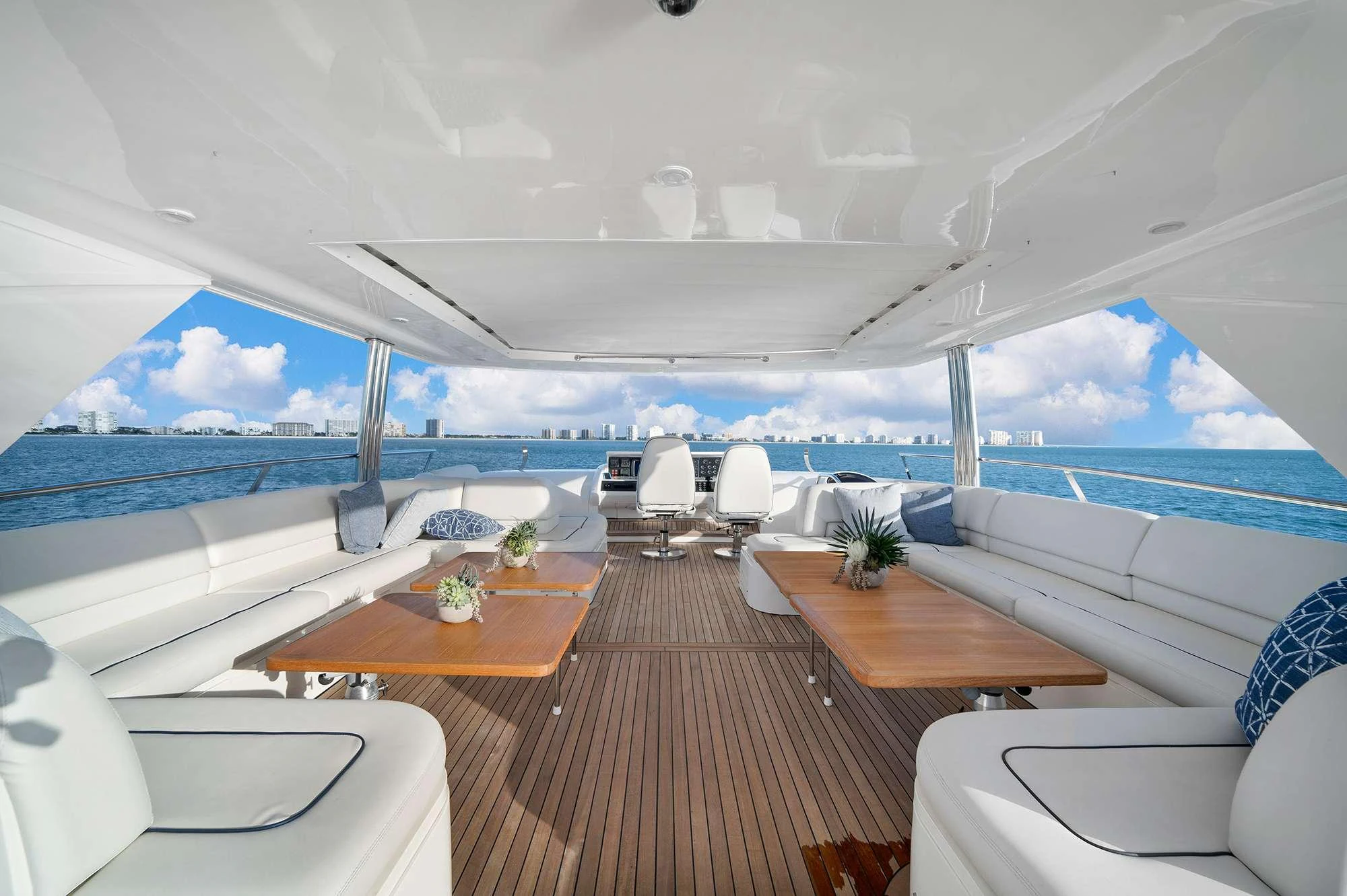 a room with a large deck and a large pool aboard CURRENT $EA Yacht for Charter