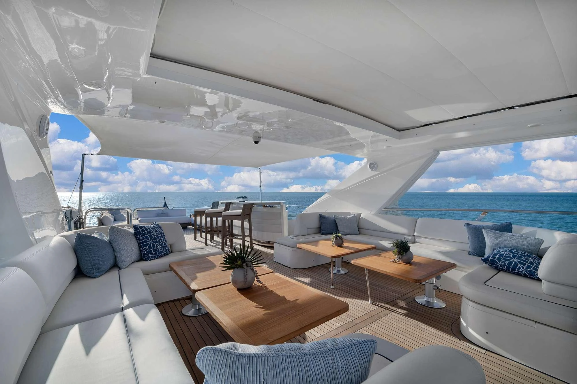 a living room with a large window aboard CURRENT $EA Yacht for Charter