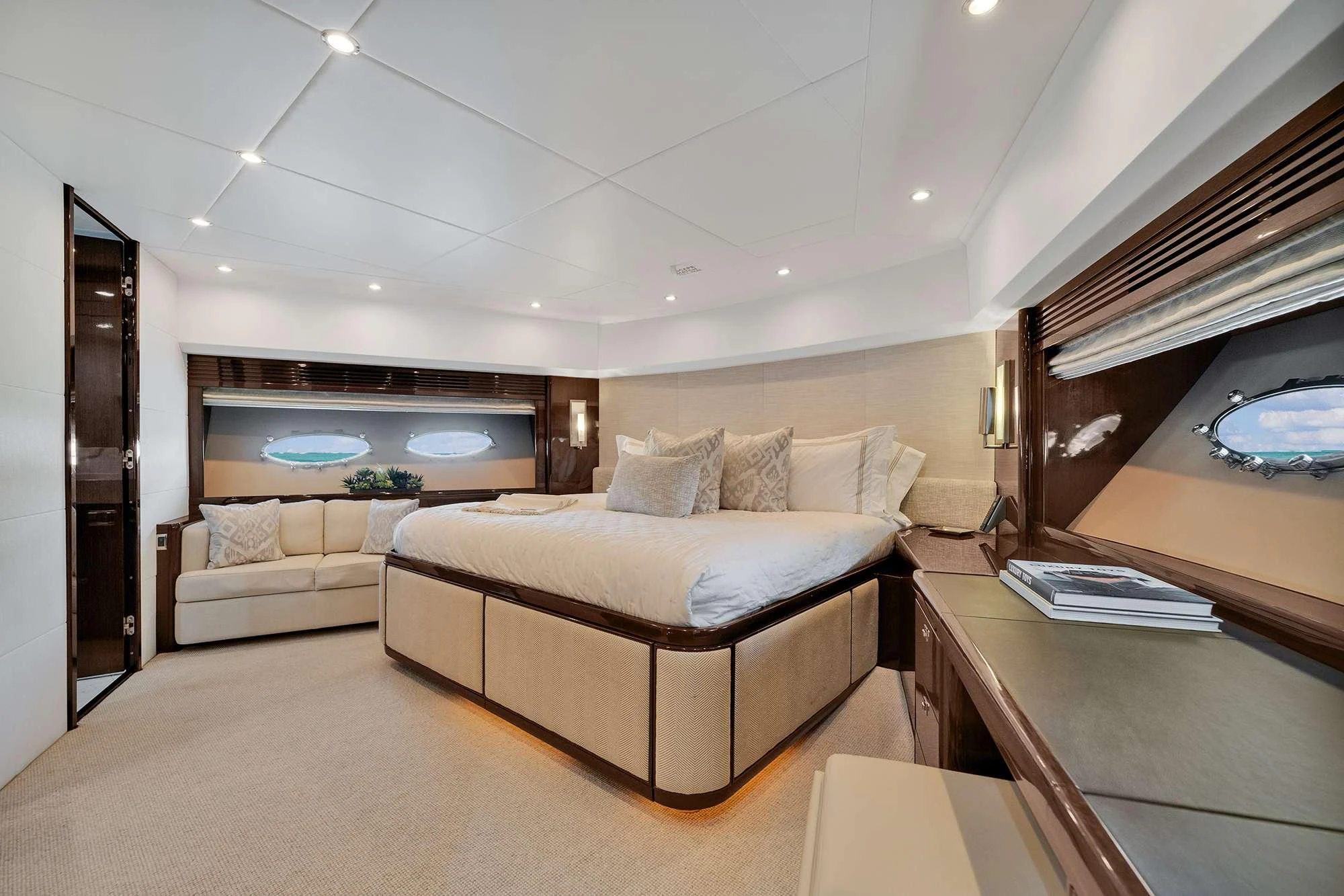 a large bedroom with a large bed aboard CURRENT $EA Yacht for Charter
