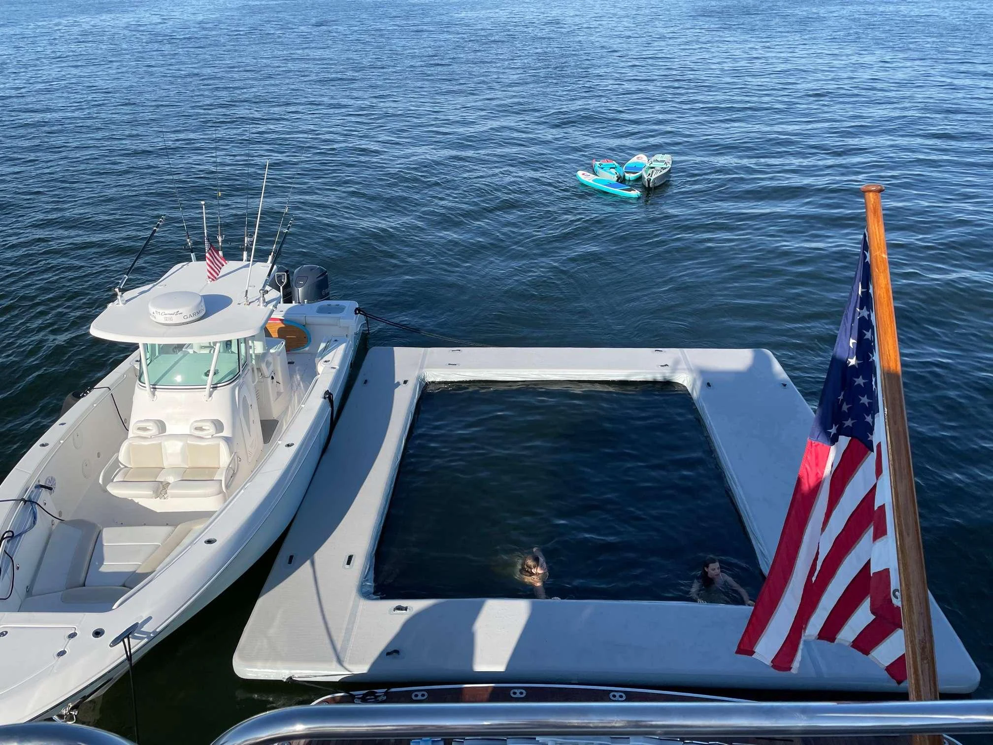 a boat with a flag on it aboard CURRENT $EA Yacht for Charter