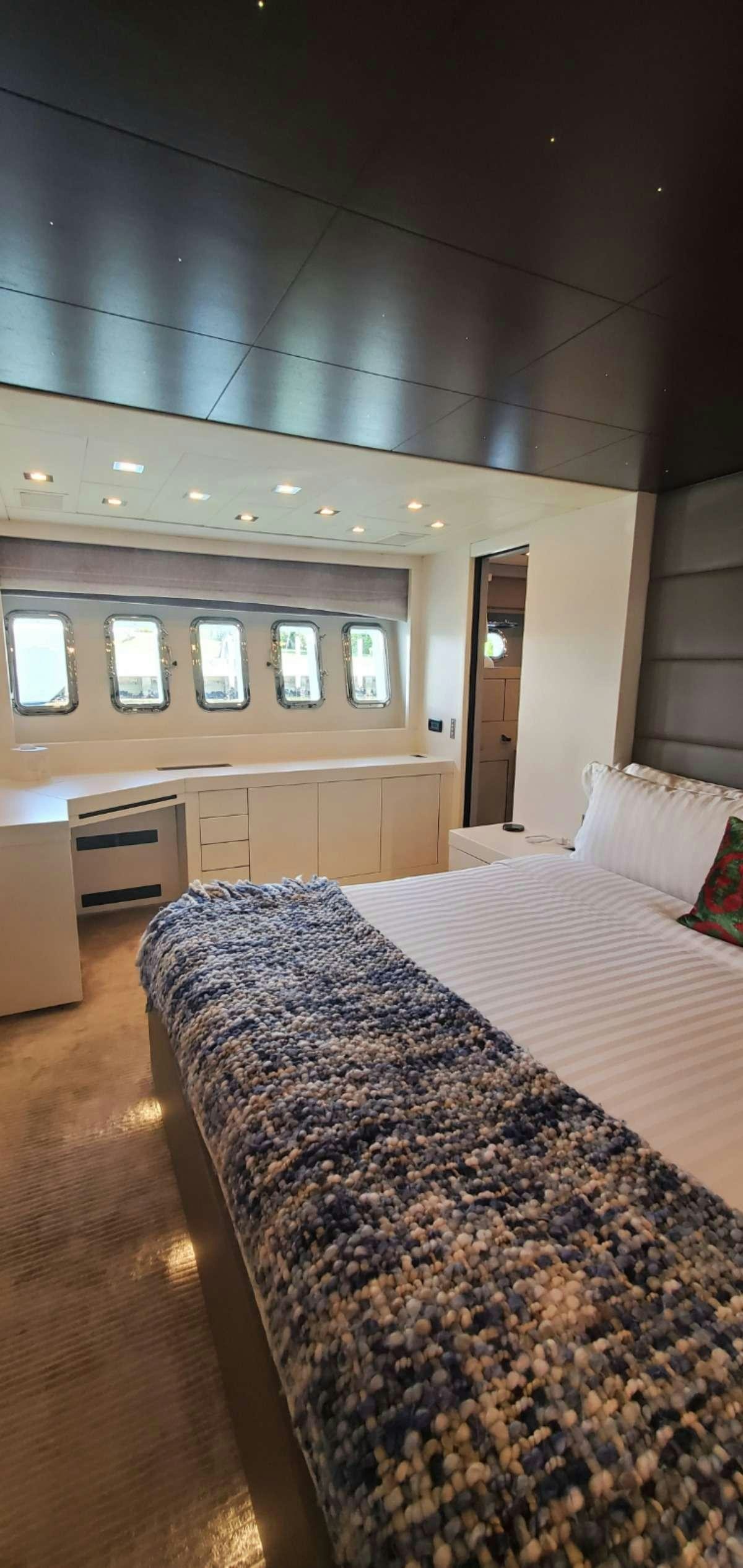 a bedroom with a bed aboard HOUDINI Yacht for Charter