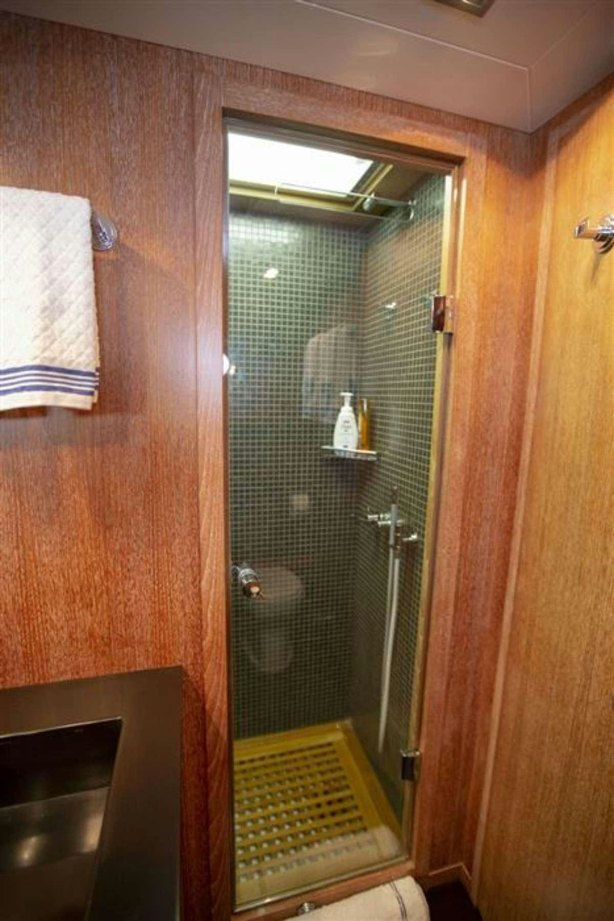 a shower unit in a bathroom aboard EVA Yacht for Charter