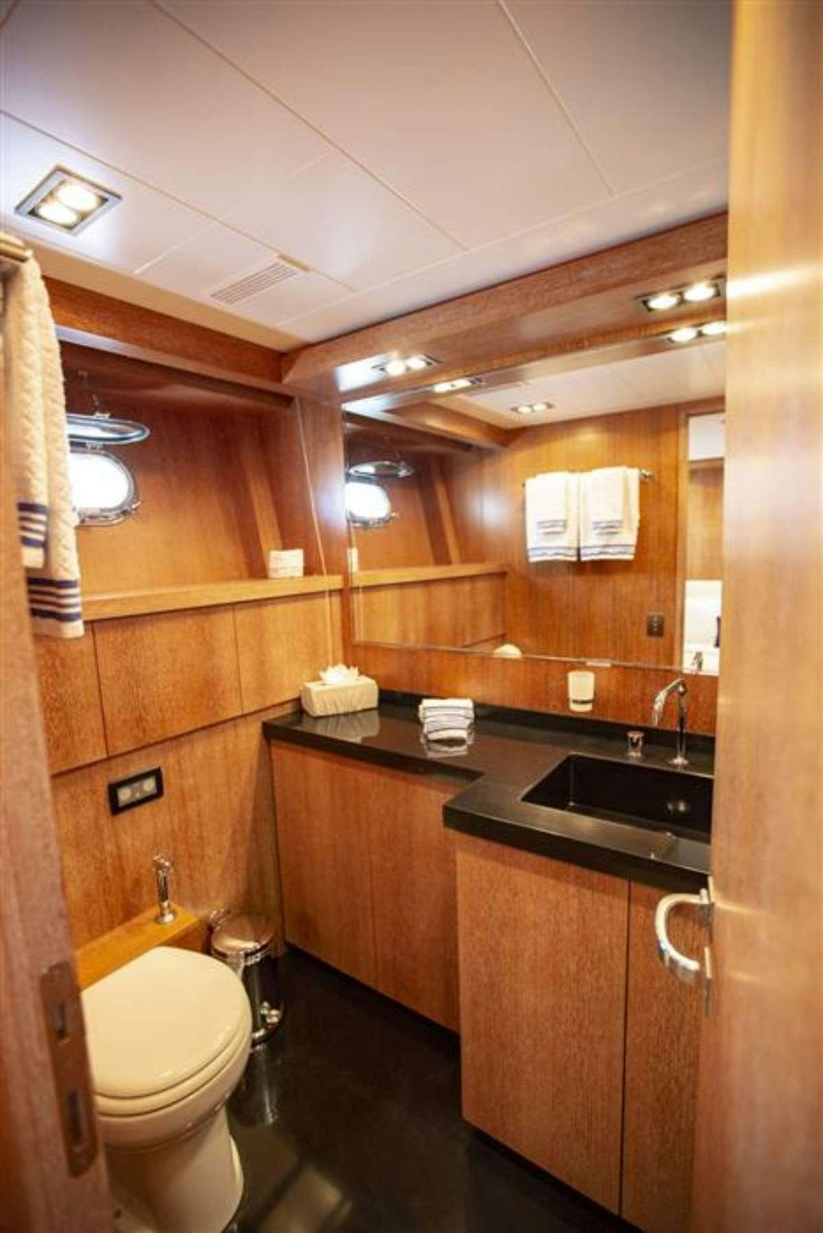 a bathroom with a sink and toilet aboard EVA Yacht for Charter