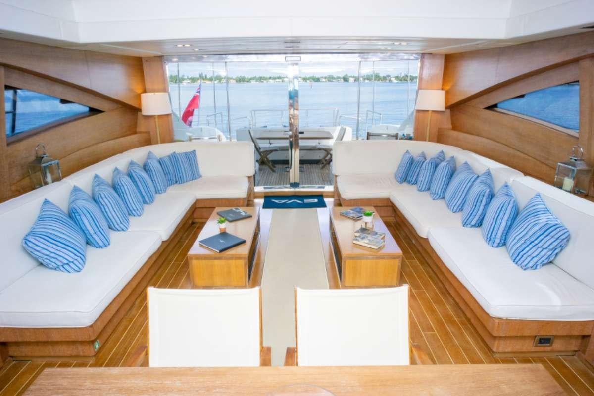 a room with a bed and a table aboard EVA Yacht for Charter