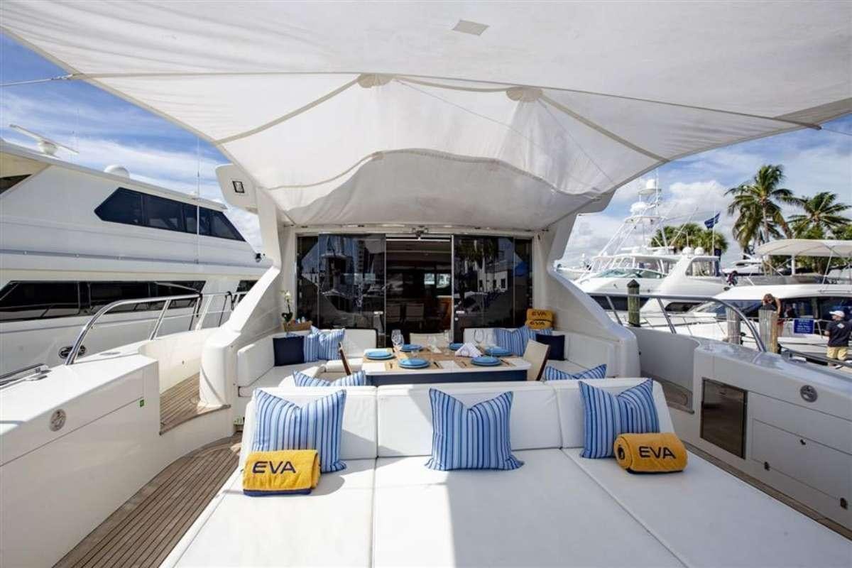 a room with a table and chairs aboard EVA Yacht for Charter