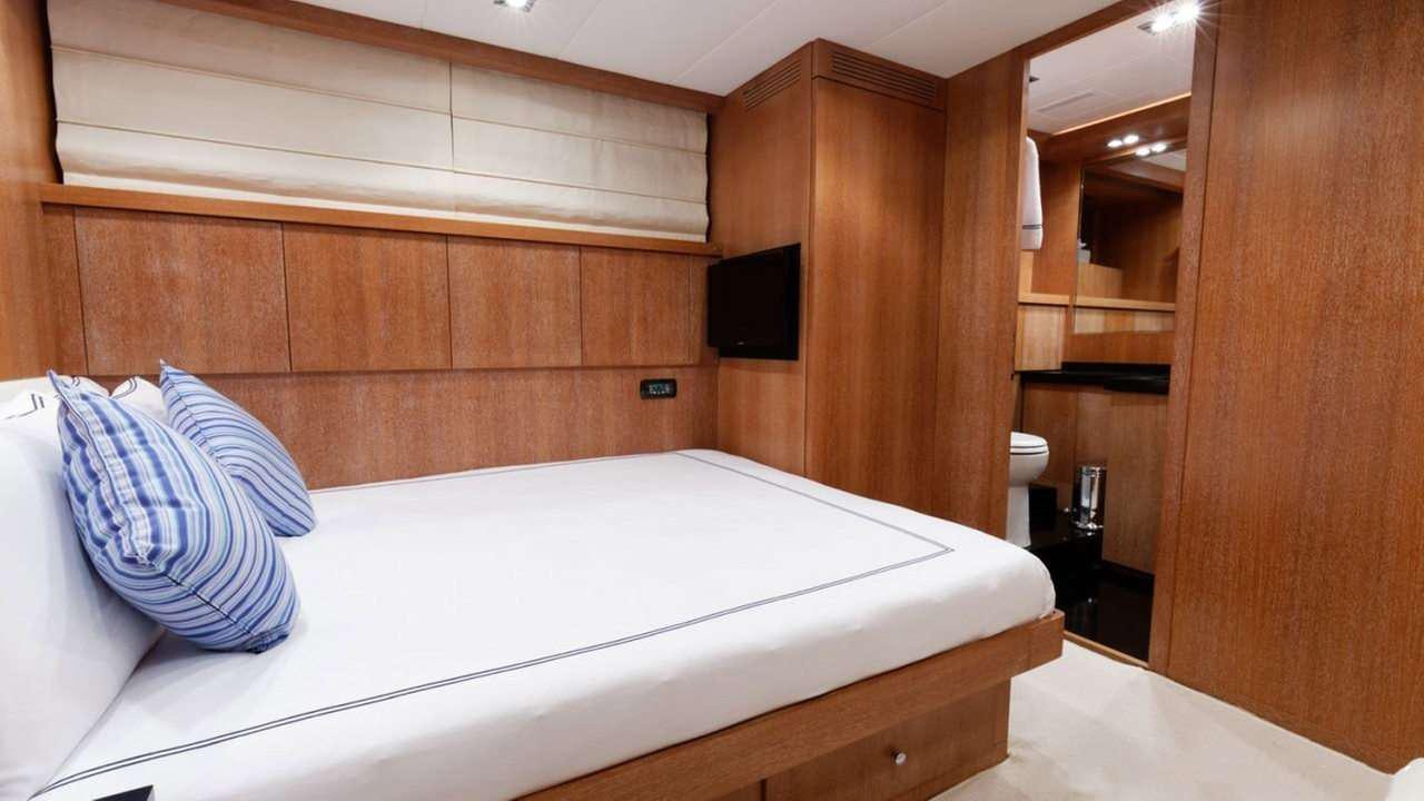 a bed in a room aboard EVA Yacht for Charter