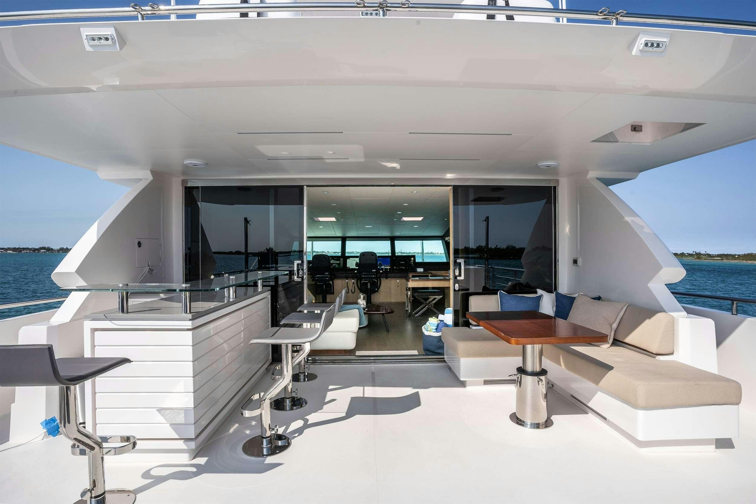 a room with a view of the ocean and the deck aboard AQUA LIFE Yacht for Charter