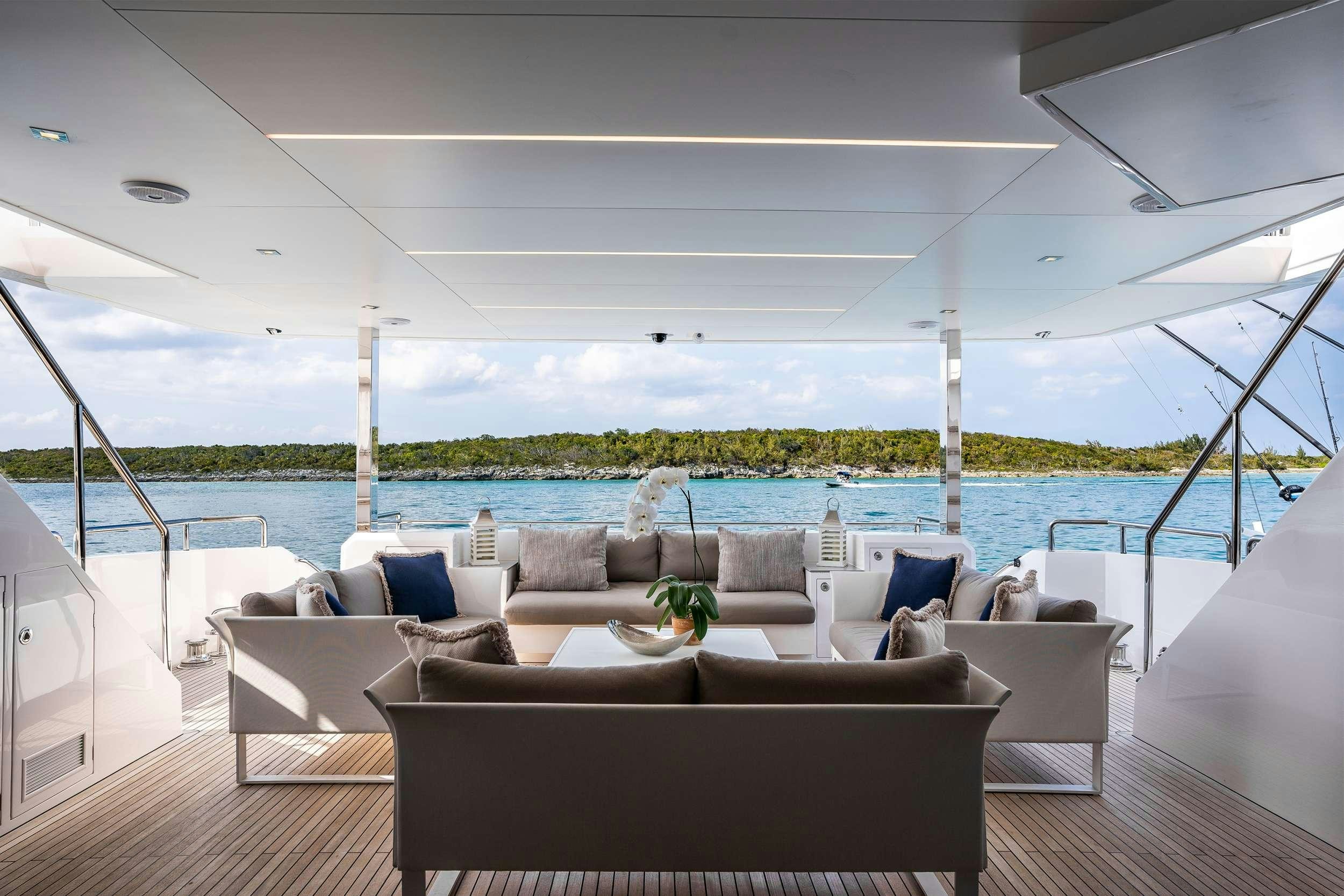 a large living room with a large body of water aboard AQUA LIFE Yacht for Charter