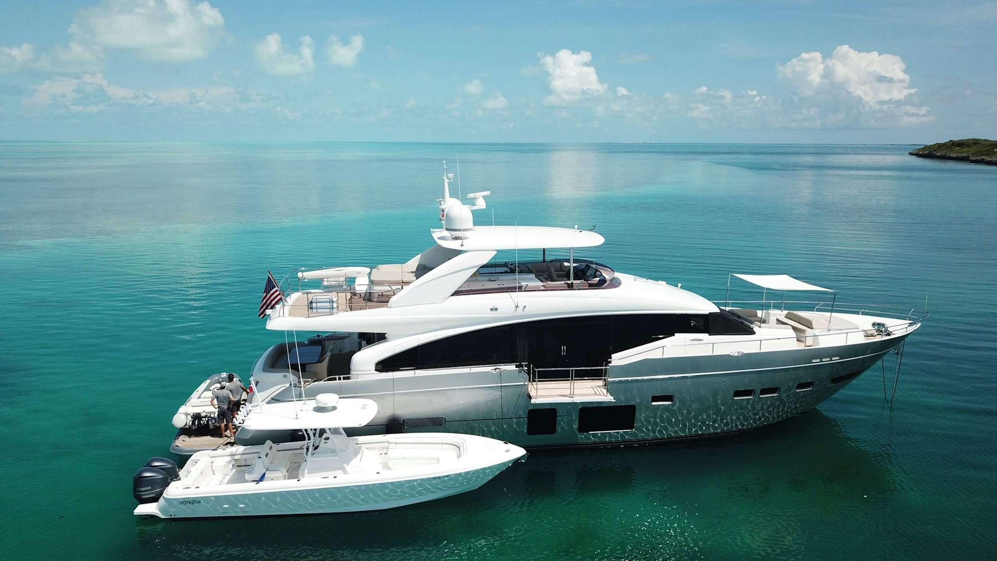 a couple of boats in the water aboard HOT PURSUIT Yacht for Charter