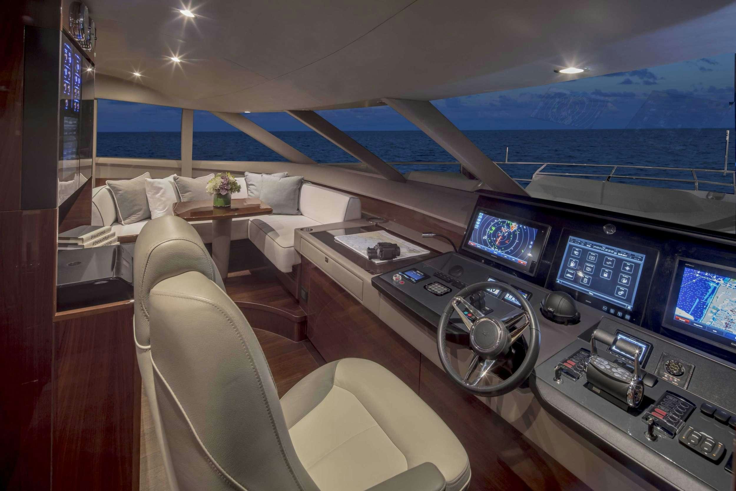 a room with a desk and several computers aboard HOT PURSUIT Yacht for Charter