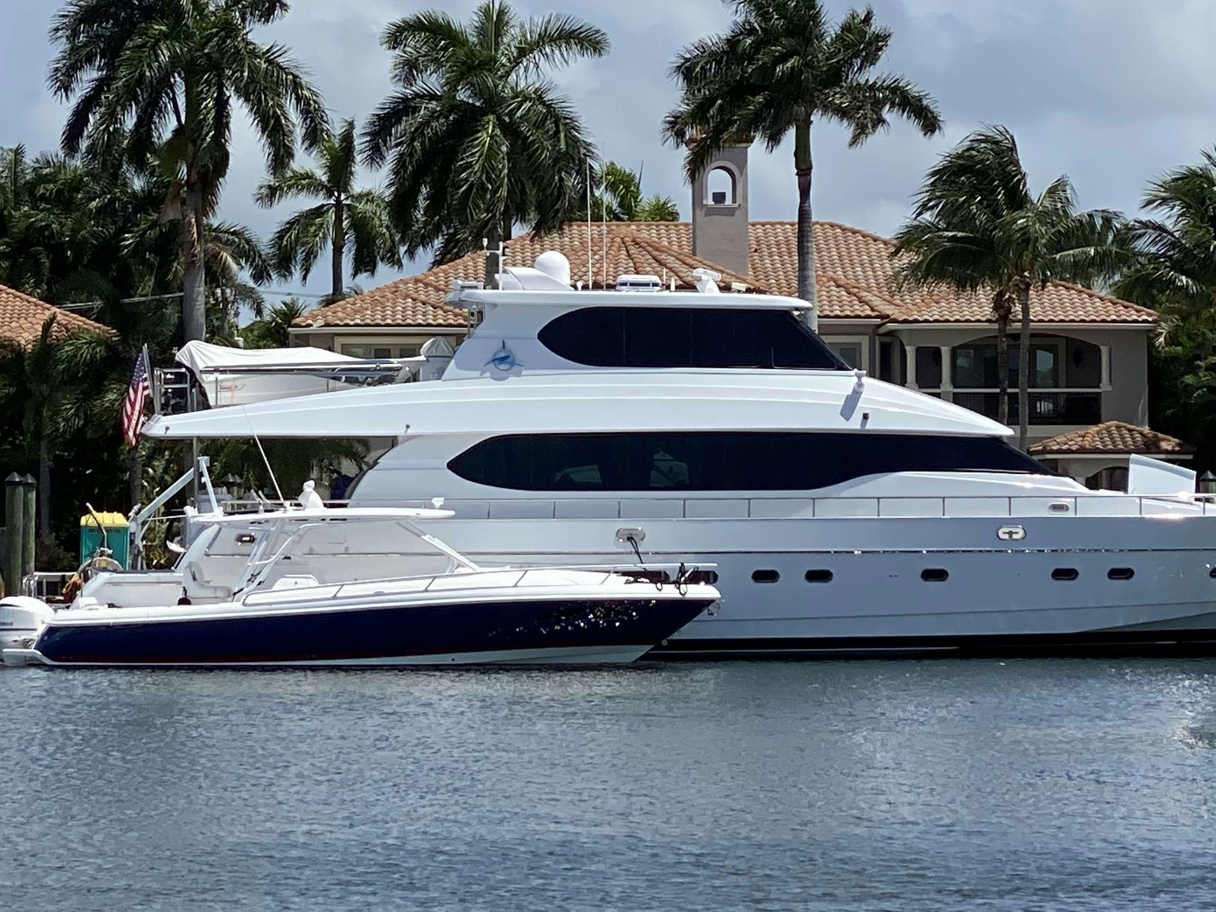 a large white yacht in the water aboard TORTUGA Yacht for Charter