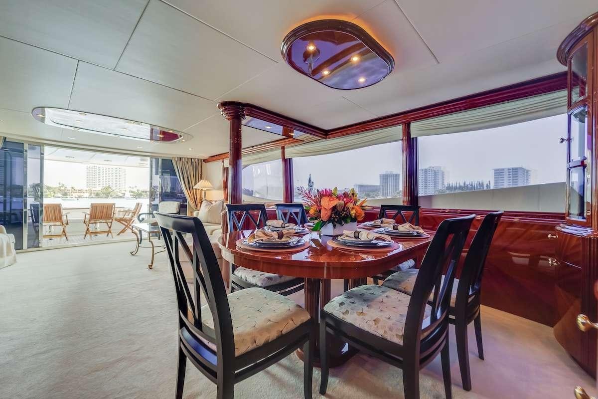 a dining room with a table and chairs aboard COPAY Yacht for Charter