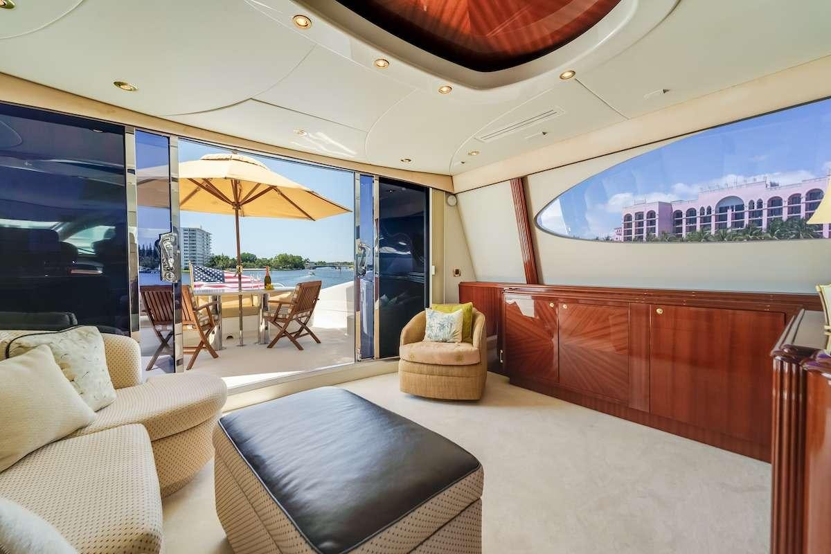 a living room with a large window aboard COPAY Yacht for Charter