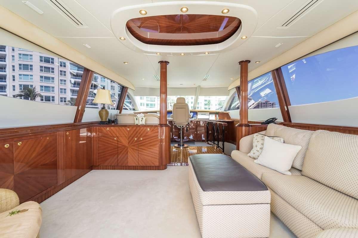 a room with couches and a table aboard COPAY Yacht for Charter