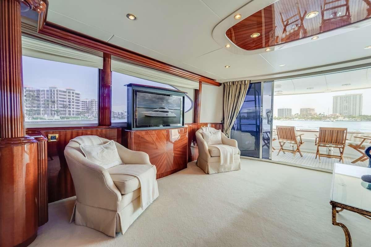 a large living room with a large window aboard COPAY Yacht for Charter
