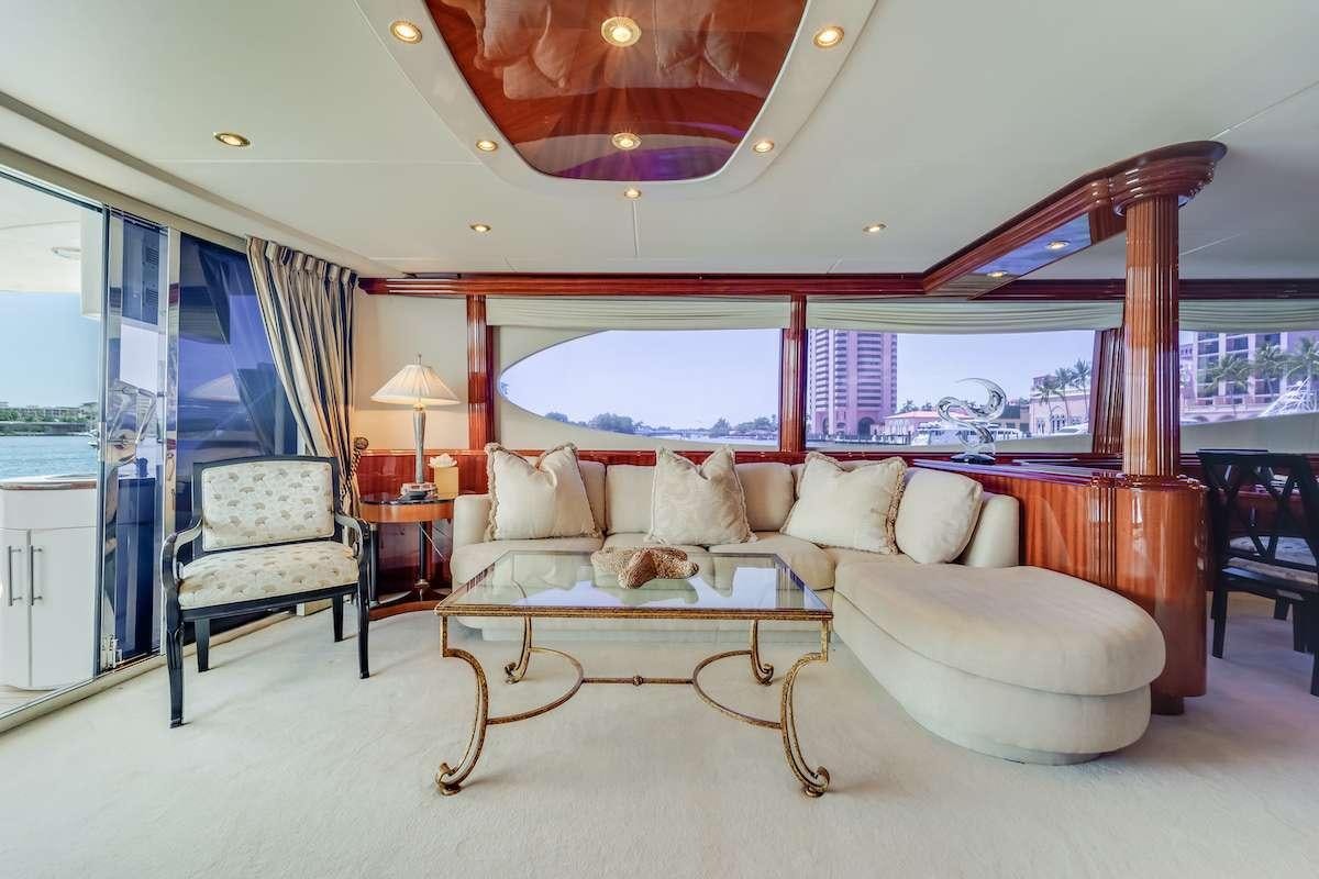 a living room with a large window aboard COPAY Yacht for Charter