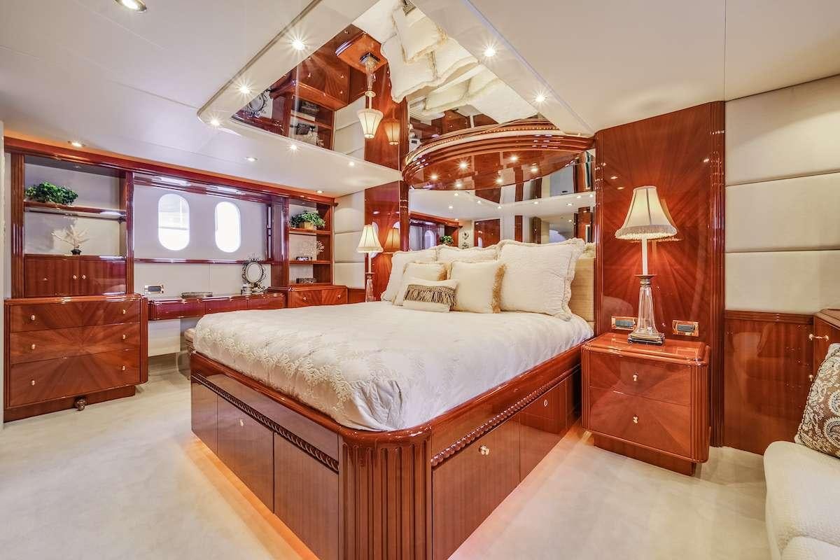 a bedroom with a bed and a desk aboard COPAY Yacht for Charter